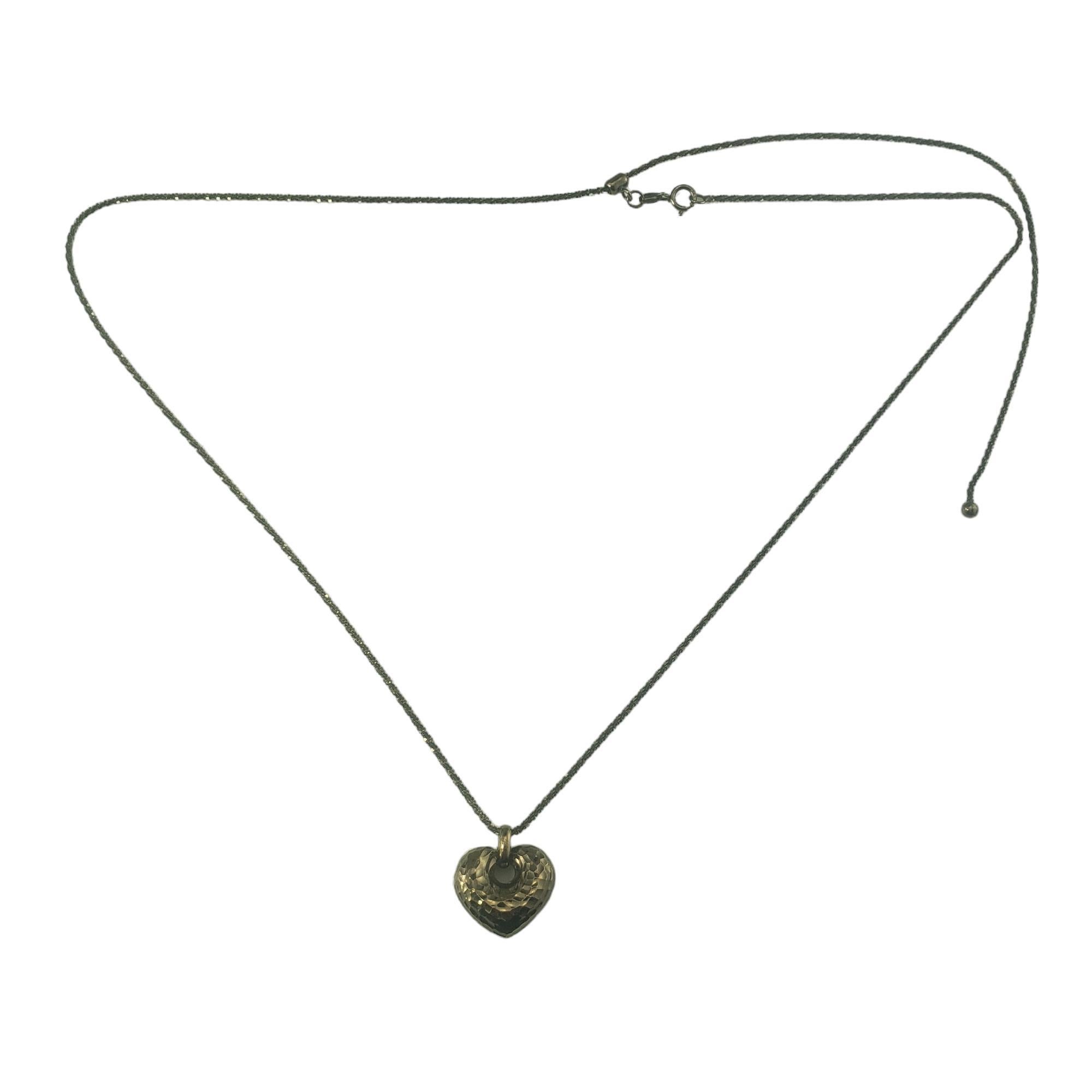Vintage 14 Karat Black Gold Heart Pendant Necklace-

This elegant heart pendant necklace is crafted in beautifully detailed 14K black gold.

Size: 24 inches, adjustable (necklace)
         15 mm x 16 mm (pendant)

Hallmark: 14KT  Italy