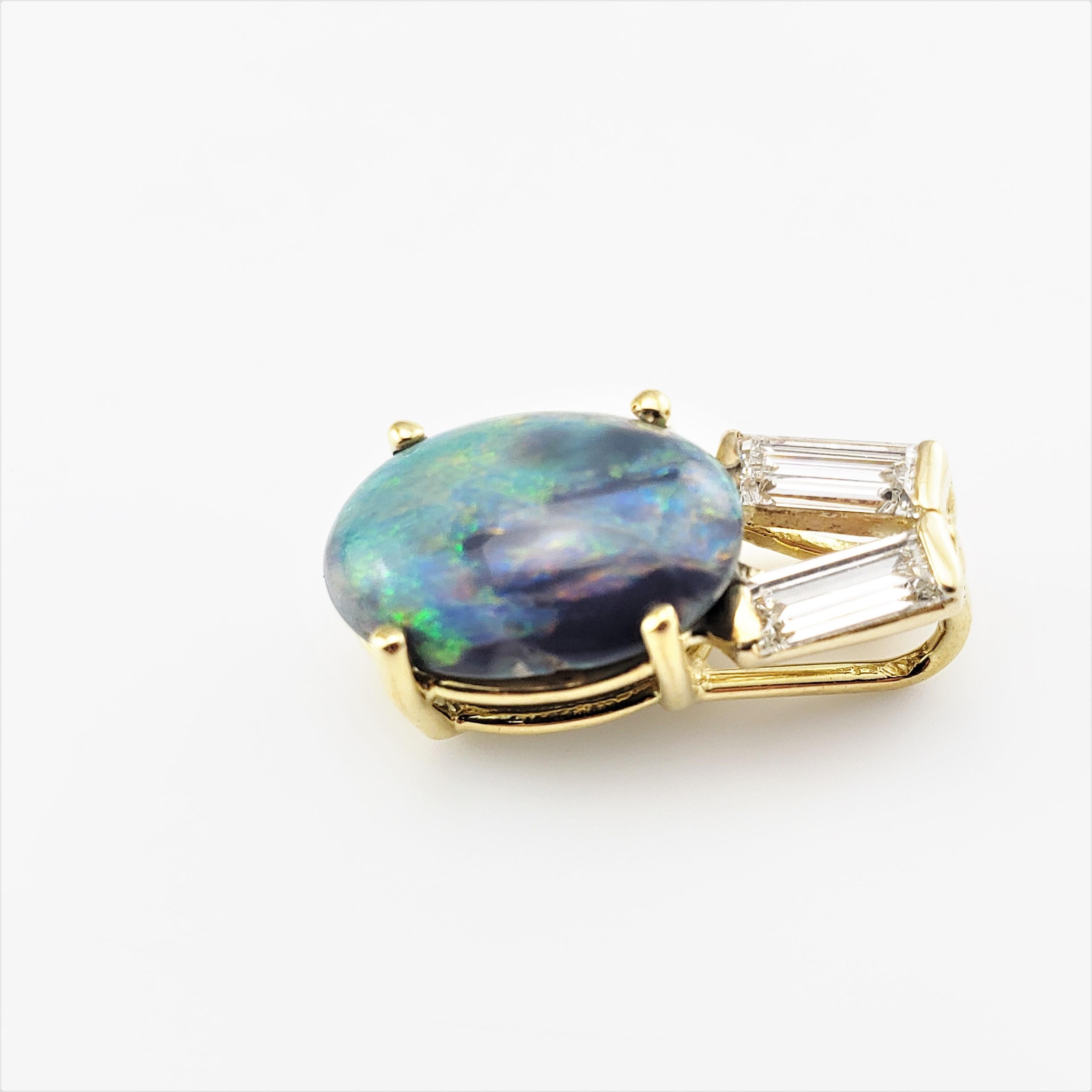 14 Karat Yellow Gold Black Opal and Diamond Pendant 

This stunning pendant features one oval black opal (12 mm x 9 mm) and two baguette diamonds set in classic 18K yellow gold.

*Chain not included.

Opal weight:  1.53 ct. ( Opal was approximately