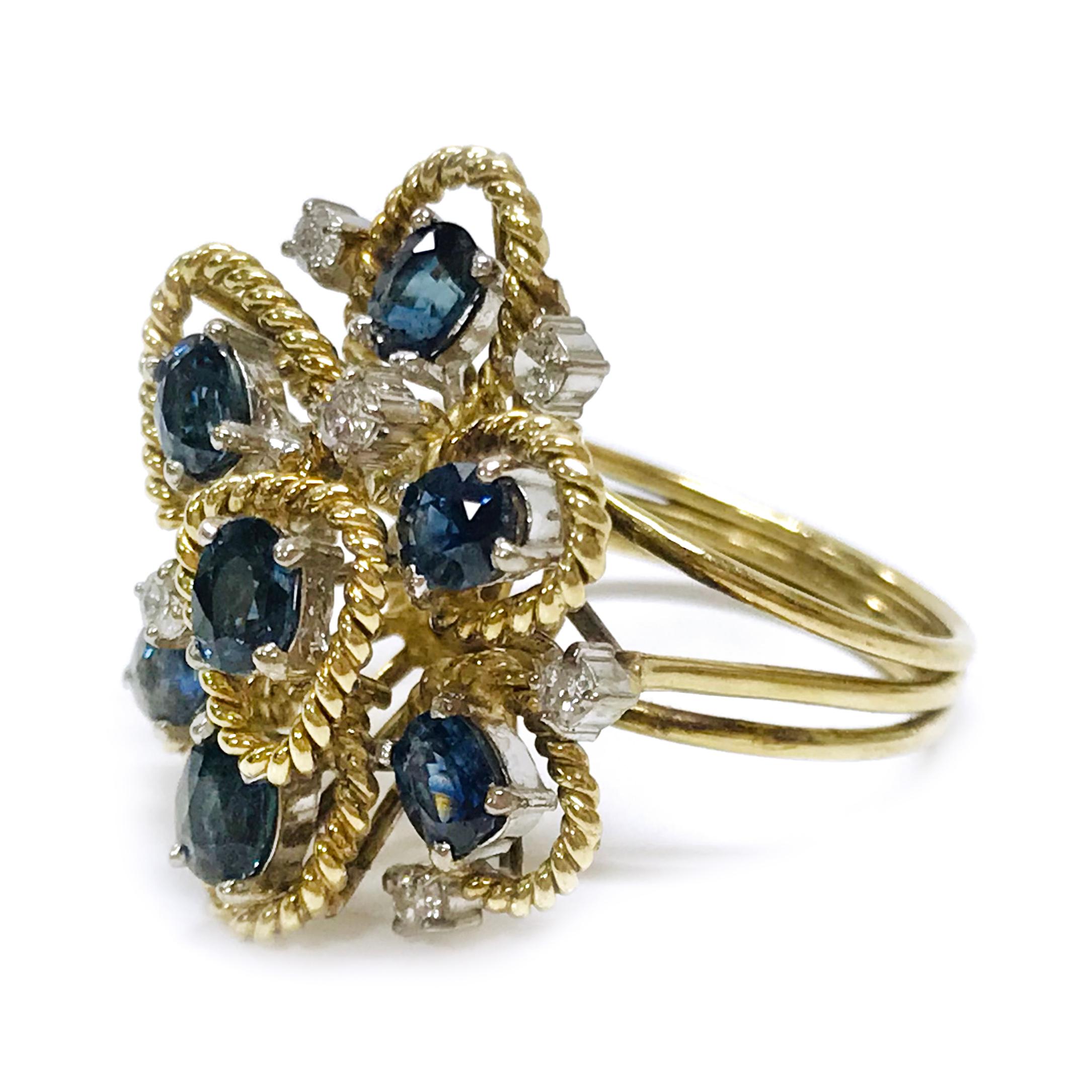 14 Karat two-tone Blue Sapphire Diamond Rope Ring. The ring features an elevated gallery of multiple tiers with medium blue oval 4.5 x3.4mm sapphires and round diamonds. All stones are prong-set in white gold and every sapphire has an outline of