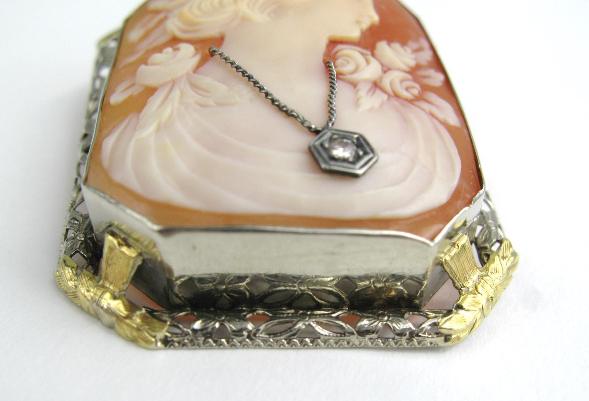 Large lovely 14K gold Carved Cameo Pin and Pendant housed in a square White and yellow gold frame. Depicting a lovely lady with a wonderful diamond necklace. It has a fold-over bale so that you can use this as a pendant as well as a brooch. It