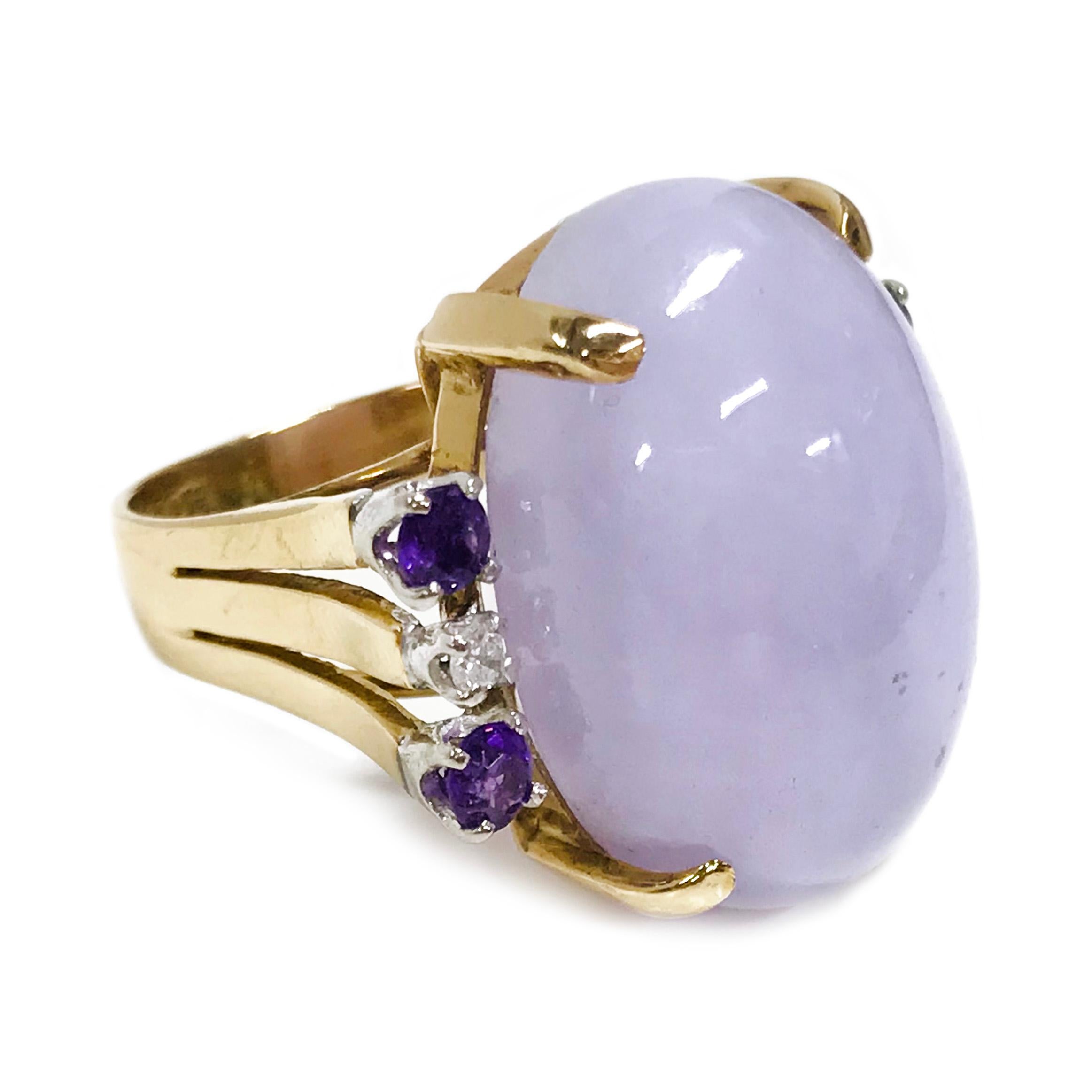 14 Karat Chalcedony Amethyst Diamond Ring. The ring features a large light blue Chalcedony oval cabochon measuring 22 x 16.5mm with four round 3mm Amethyst and two 2.5mm round diamonds, all prong-set. The Amethysts and diamonds are set in white