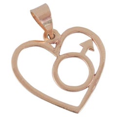Retro 14 karat Chanti gold pendant in the shape of a heart with a male symbol. 
