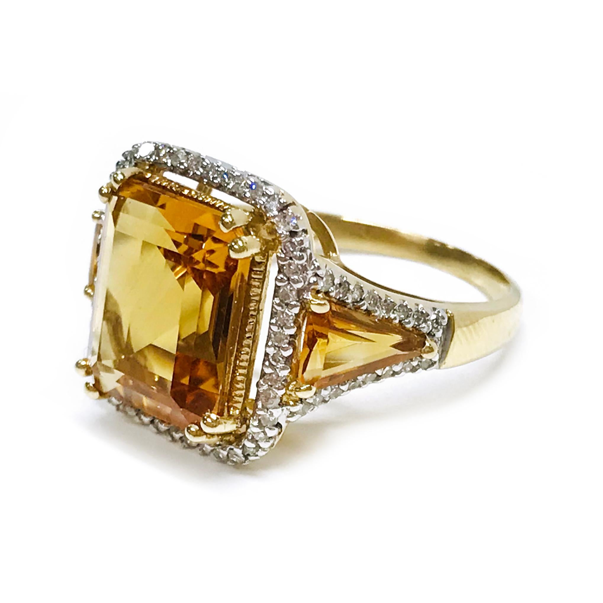 14 Karat Citrine Diamond Ring. The ring features a 12 x 10mm square prong-set step-cut golden color Citrine and two triangle baguette citrines with a halo of round diamonds in between and around all three Citrines. The diamonds have a total carat