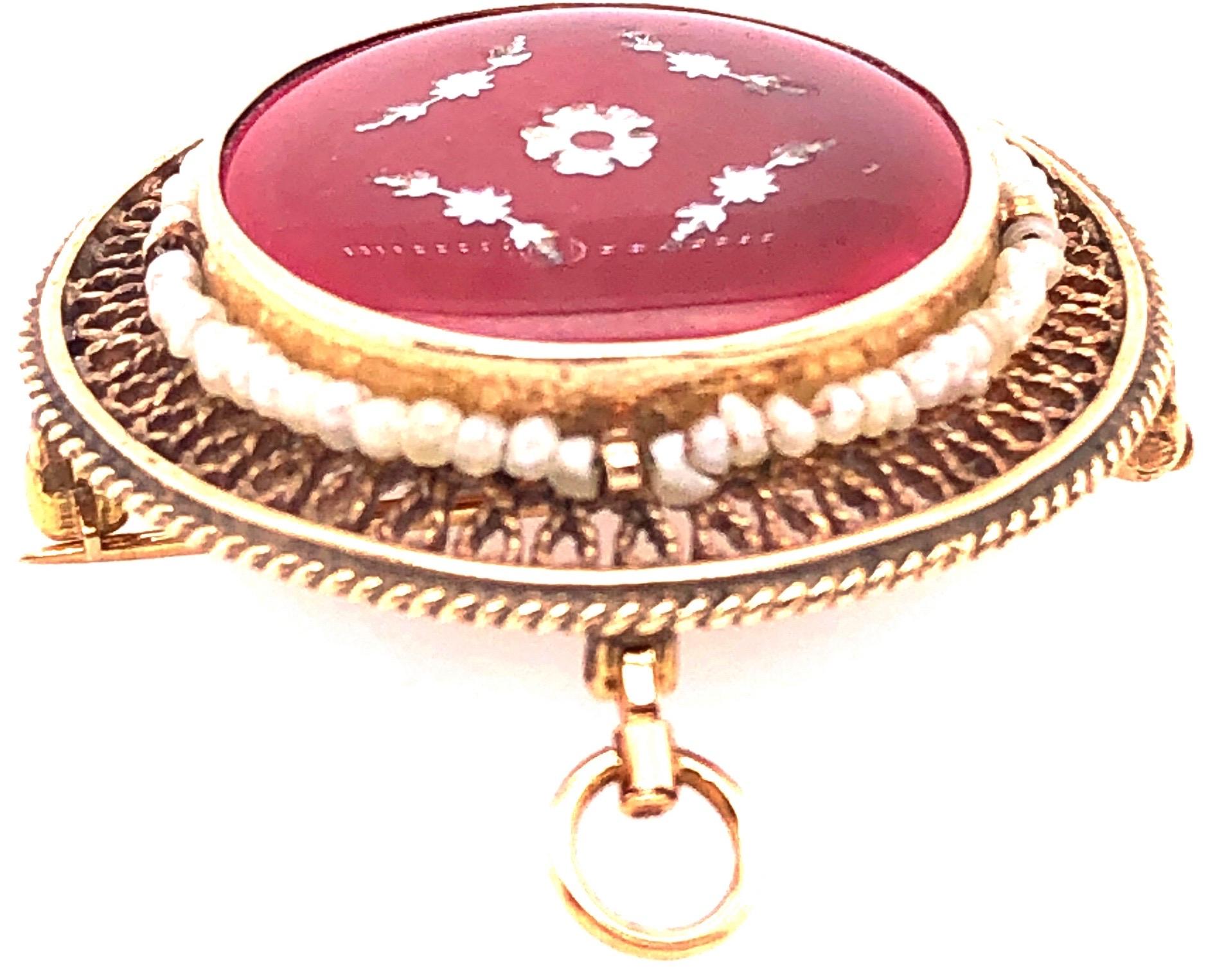 14 Karat Contemporary Brooch and Pendant with Pearls.
64 piece round pearls.
8 grams total weight.