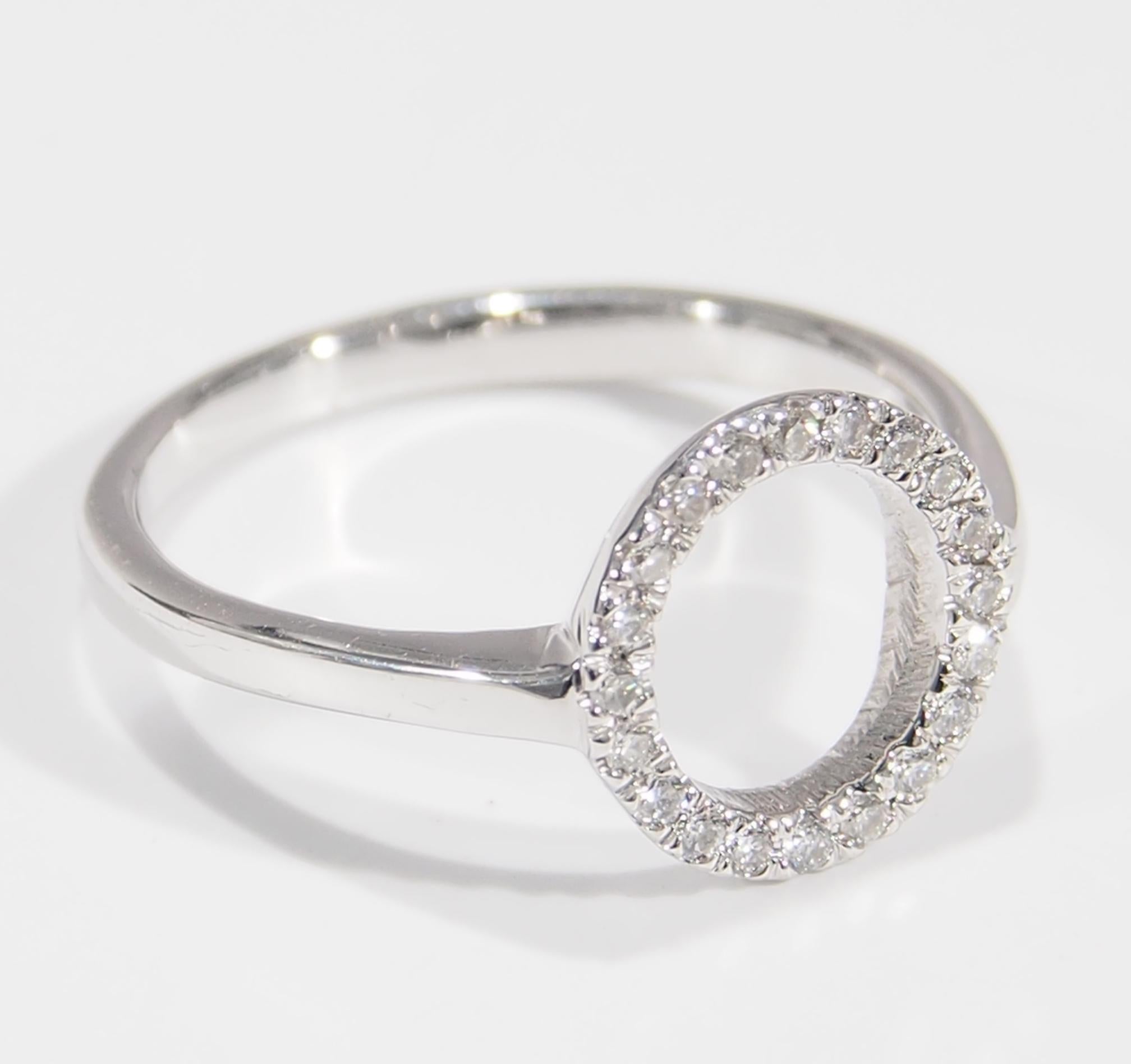 This is a delightful 14K White Gold Ring with (20) Round Brilliant Diamonds, approximately 0.12ctw, G-H in Color, VS-SI in Clarity set in an open circle. A precious style that is easy to wear every day and also can make a great gift. The Ring is a