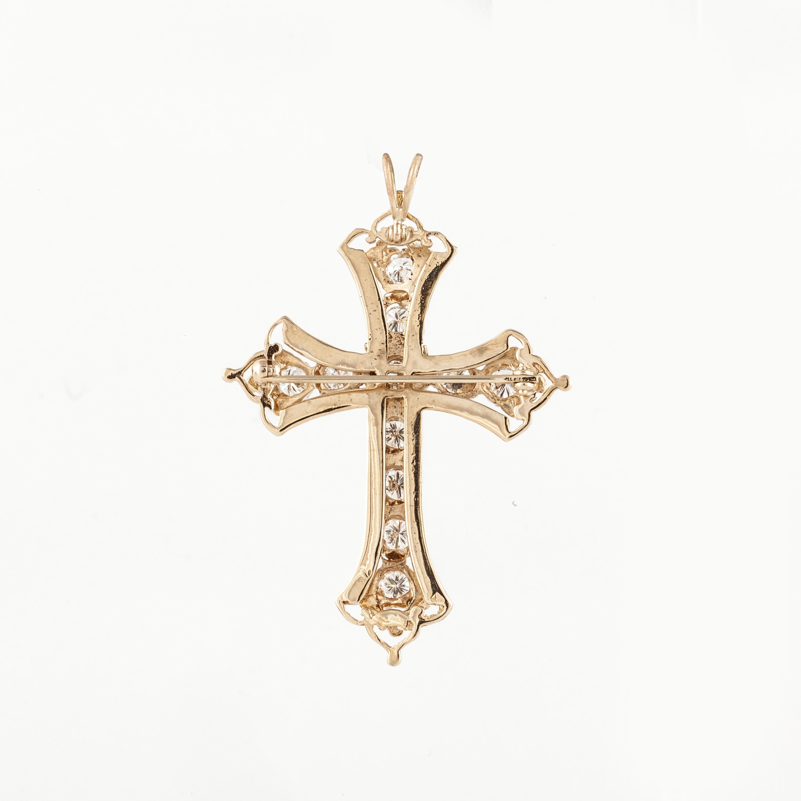 14K yellow gold diamond cross pin/pendant.  Total of eleven (11) round diamonds with a total carat weight of 2.50; they are G-H in color and SI-1 in clarity.  There is also black enameling along the edges.  Measures 2-3/8