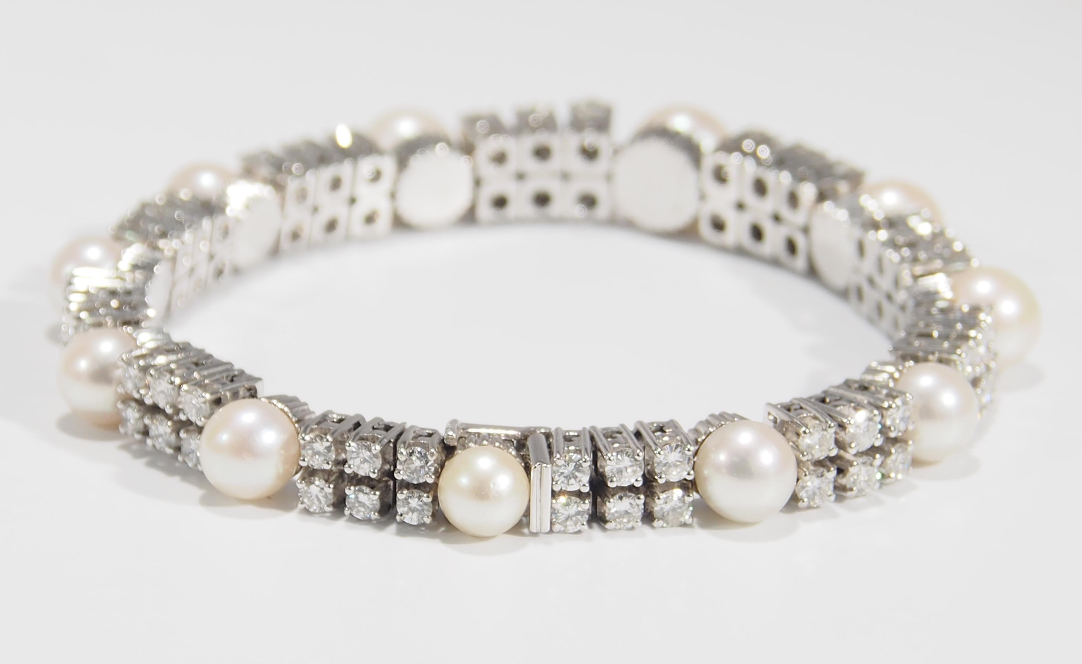 This is a classic Diamond and Pearl Bracelet fashioned in 14K White Gold. The Bracelet sparkles with (66) Round Brilliant Cut Diamonds, approximately 6.30ctw, G-H in Color, VS in Clarity. The Diamonds are set in Groups of (6) that alternate with