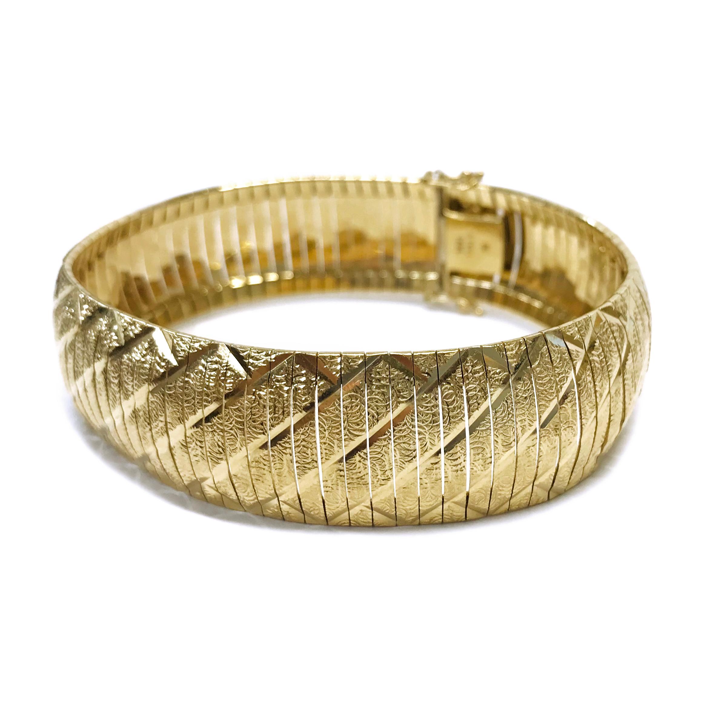 14 Karat Diamond-Cut Cubetto Bracelet. The bracelet consists of individual flexible gold bars, diamond-cut and smooth. Stamped on the inside of the clasp is 14K ITALY MI, the Italian maker's mark from Milano, Italy. The bracelet is 17mm wide and 7
