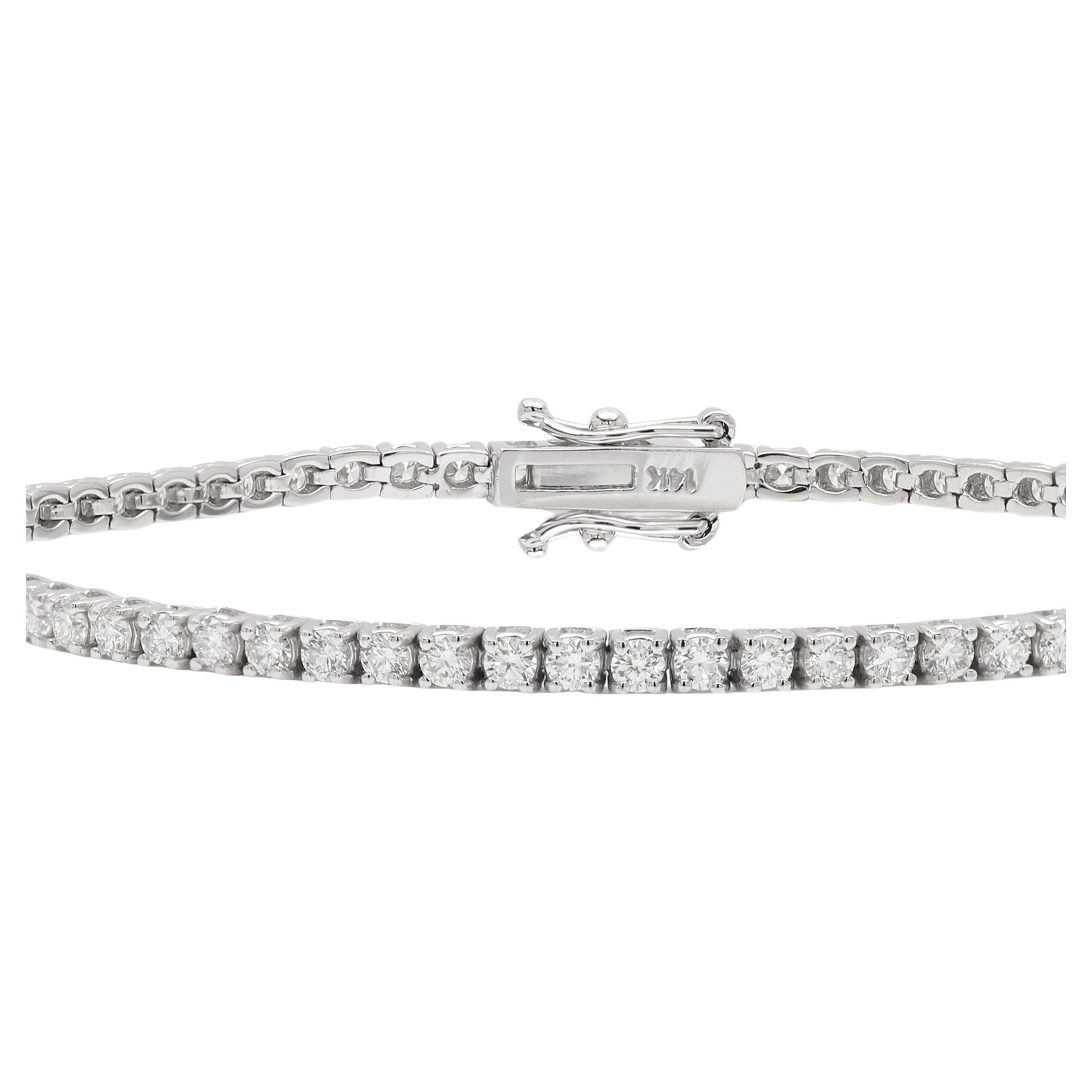 New
Classic Diamond Tennis Bracelet
Thin but not too thin, on the good balance of not too large but not too thin.
Authentic 14k White Gold approx Weight 6.3 grams  (for yellow gold - please inquire)
Natural round Diamonds Total weight approc 2.0