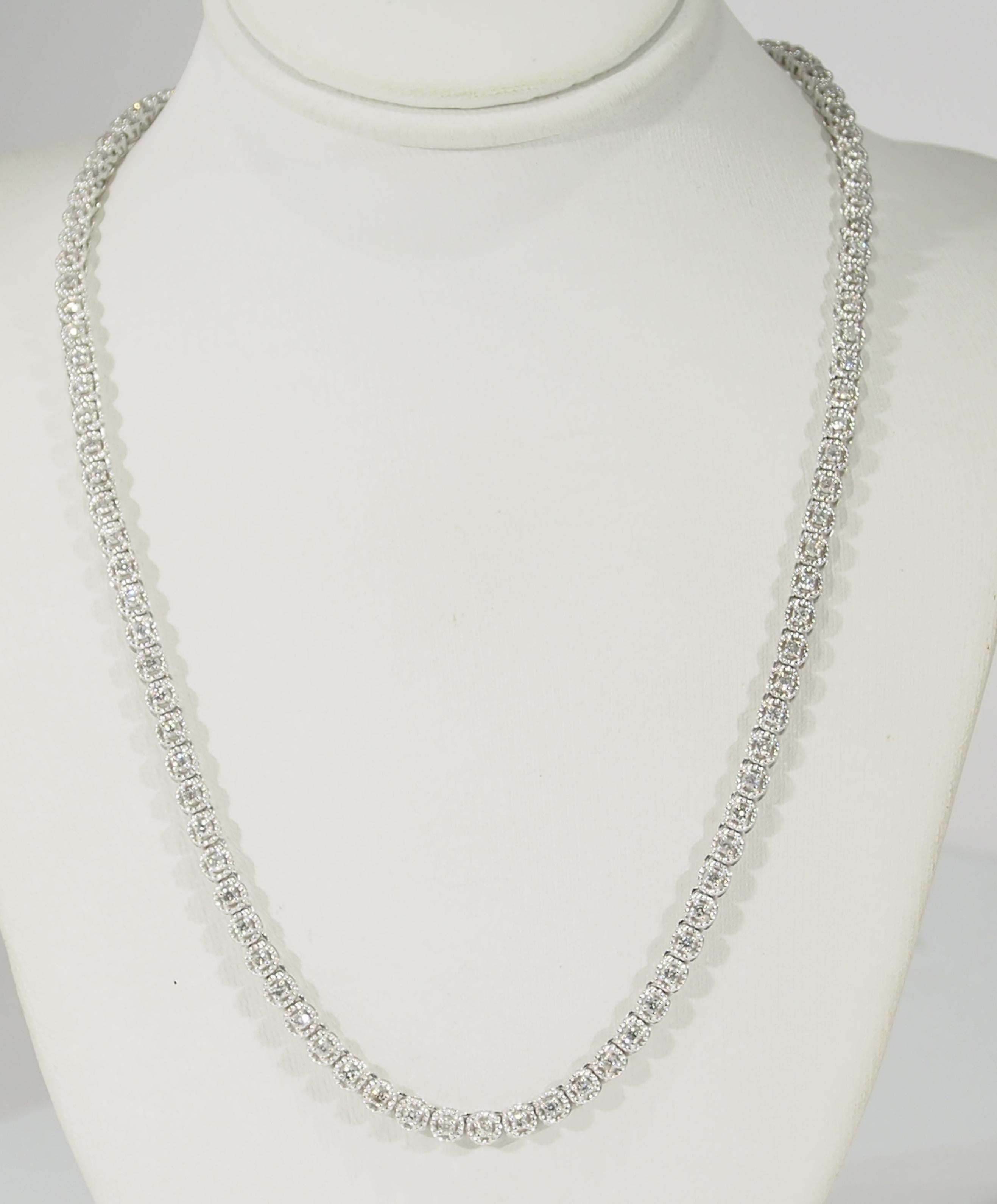 This is a lustrous 14K White Gold Tennis Necklace designed with Rope-Like settings encircling the 123 Round Brilliant Cut Diamonds, approximately 2.25ctw, G-H in Color, VS-SI3 in Clarity allowing this Necklace to Sparkle in a 17 inch length. An