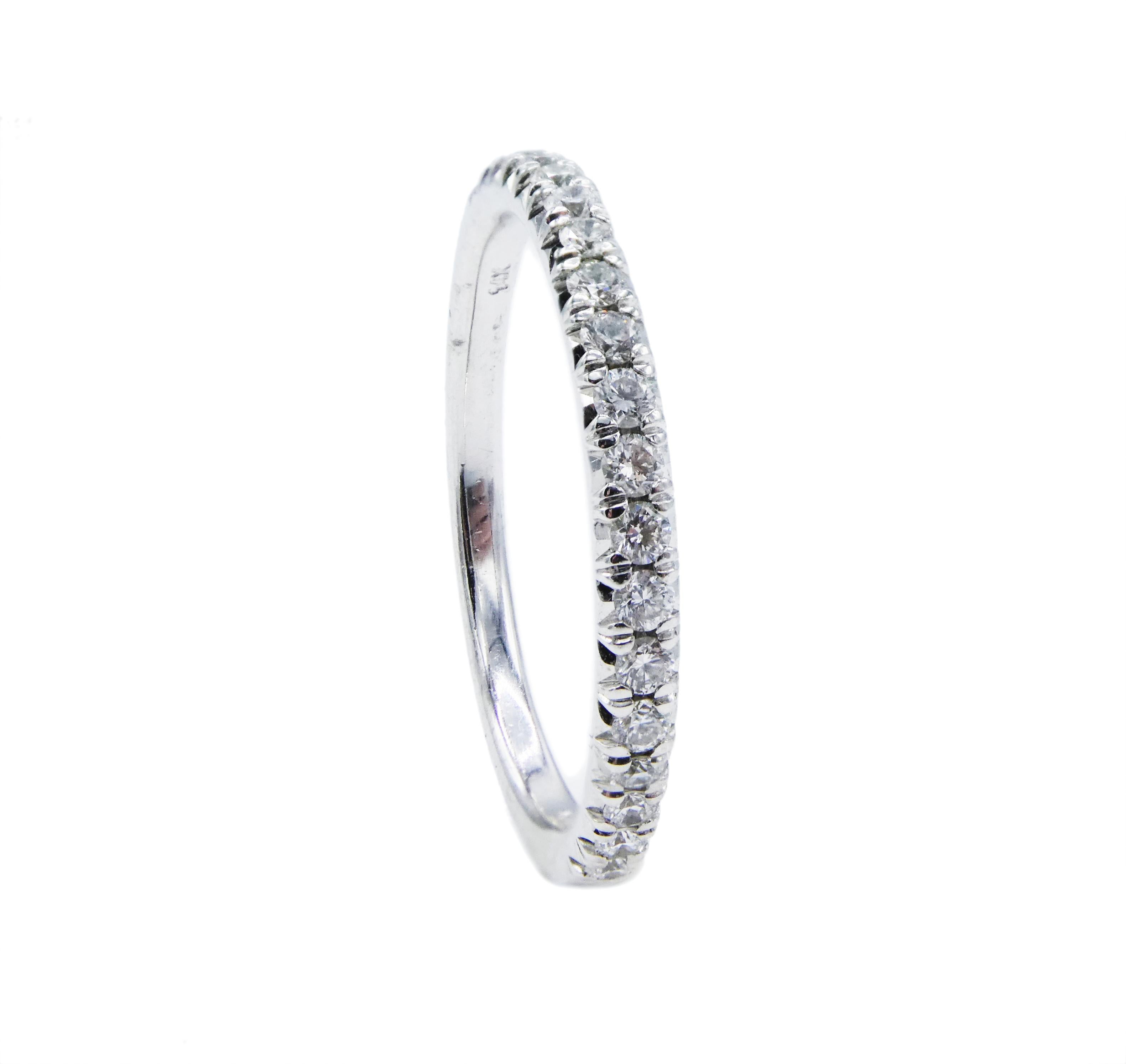 14 Karat Diamond Wedding Band 0.20 CTW White Gold Half Ring Size 6.5

Metal: 14k White Gold
Weight: 2.02 grams
Diamonds: 19 round brilliant cut diamonds, approx. .20 CTW G SI
Size: 6.5 (US)
Width: 2.2MM