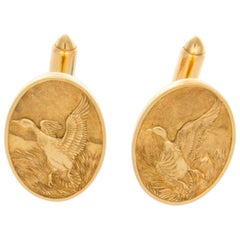 14 Karat Disc Cufflinks with a Flying Duck Motif and Toggle Backs