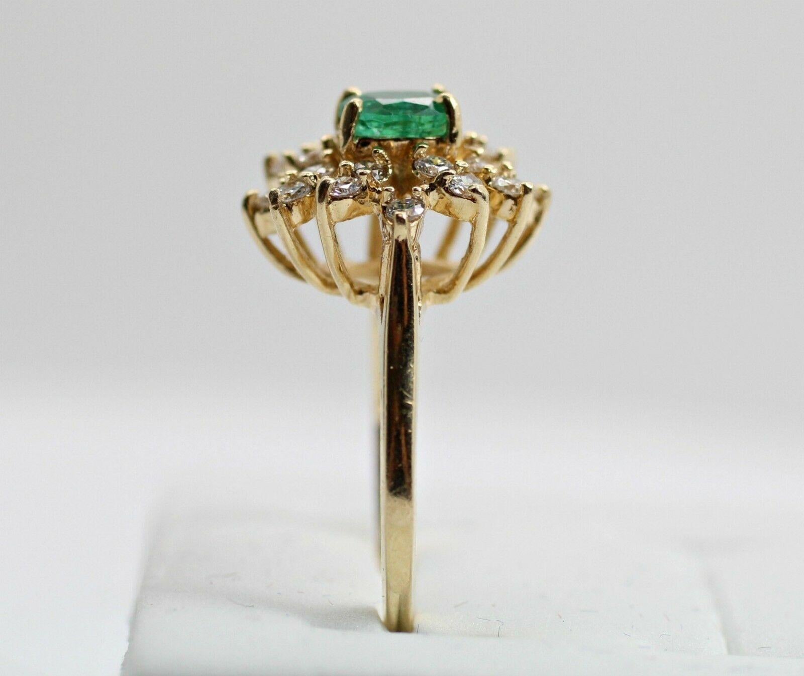 Contemporary 14 Karat Emerald and Diamond Cluster Ring