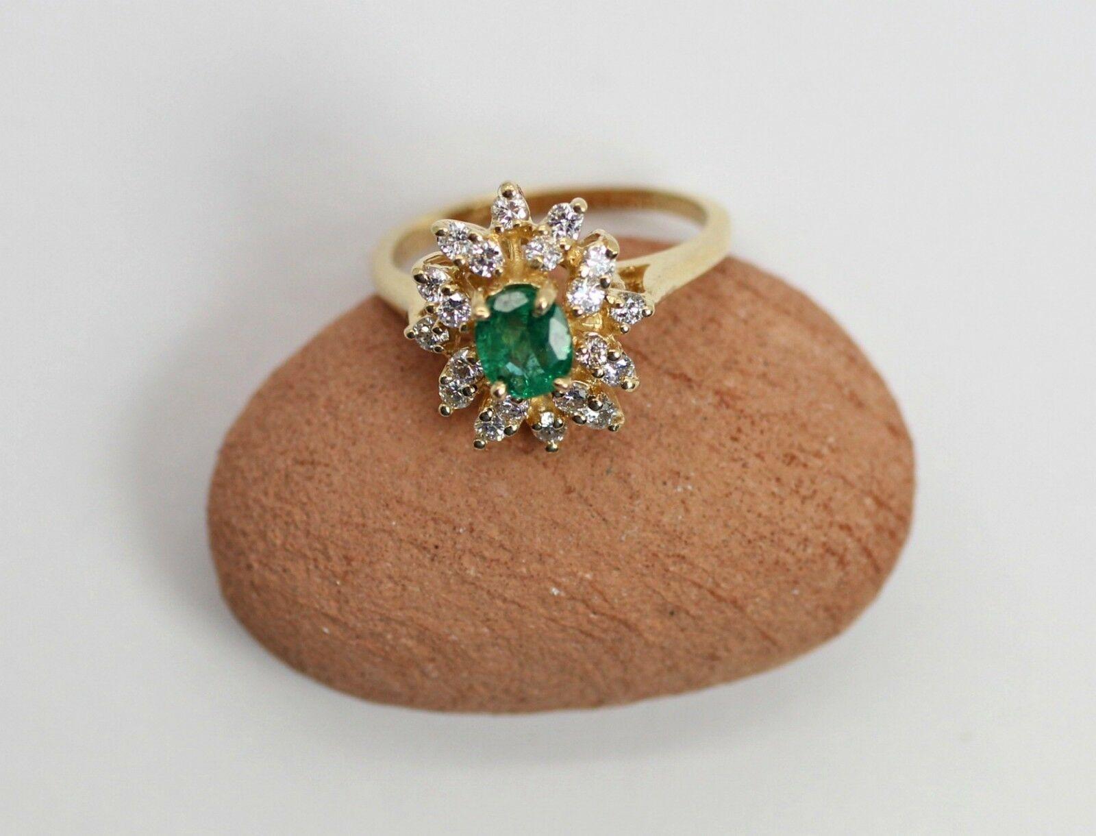 Oval Cut 14 Karat Emerald and Diamond Cluster Ring