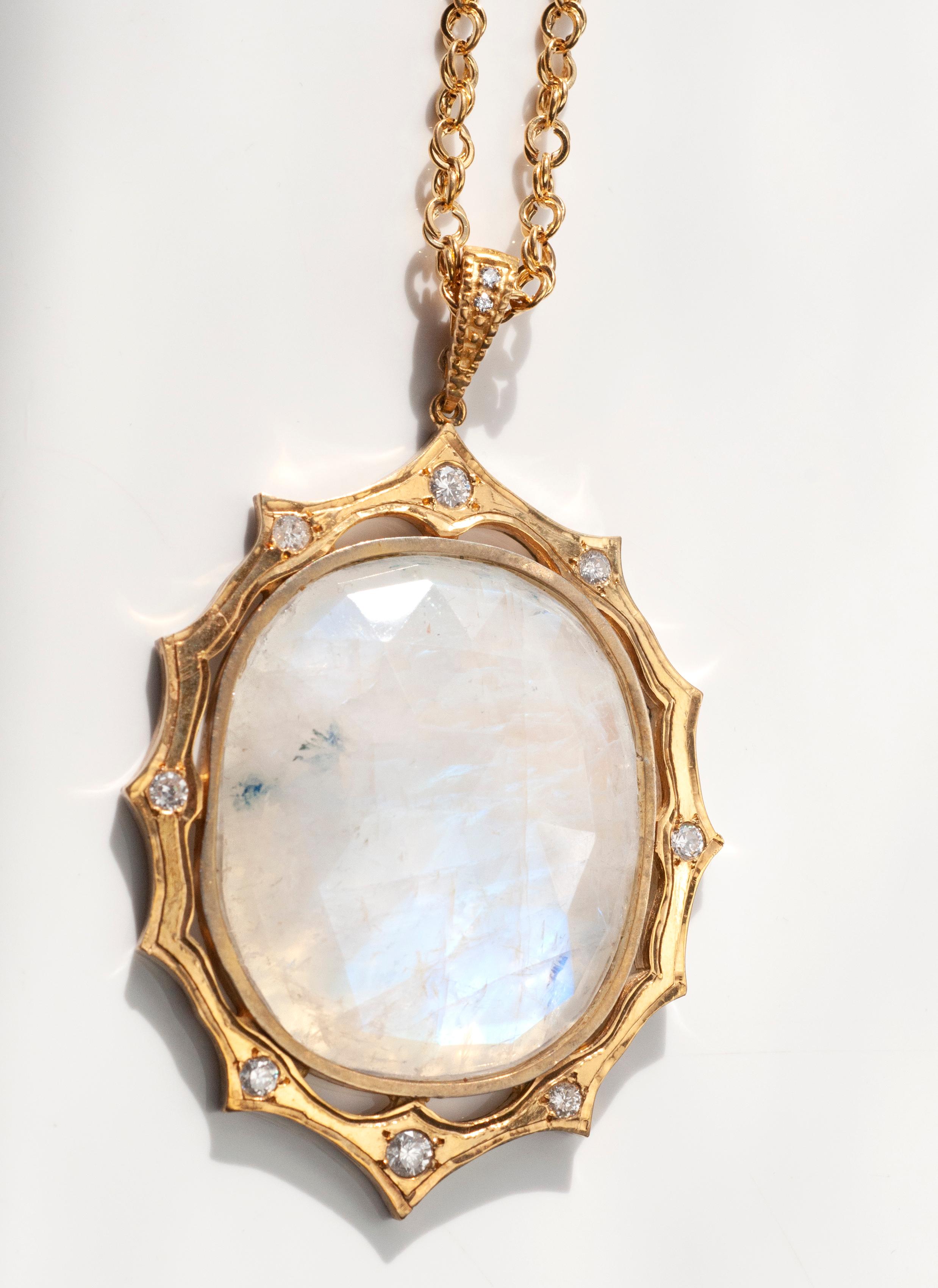 18 Karat Yellow Gold Pendant with Faceted Moonstone cabuchon approx 65.94cts and pave white brilliant diamonds 0.94cts on 20 inch 14K yellow gold chain. 
This statement necklace is great on a white summer dress or wear it for a evening out with our