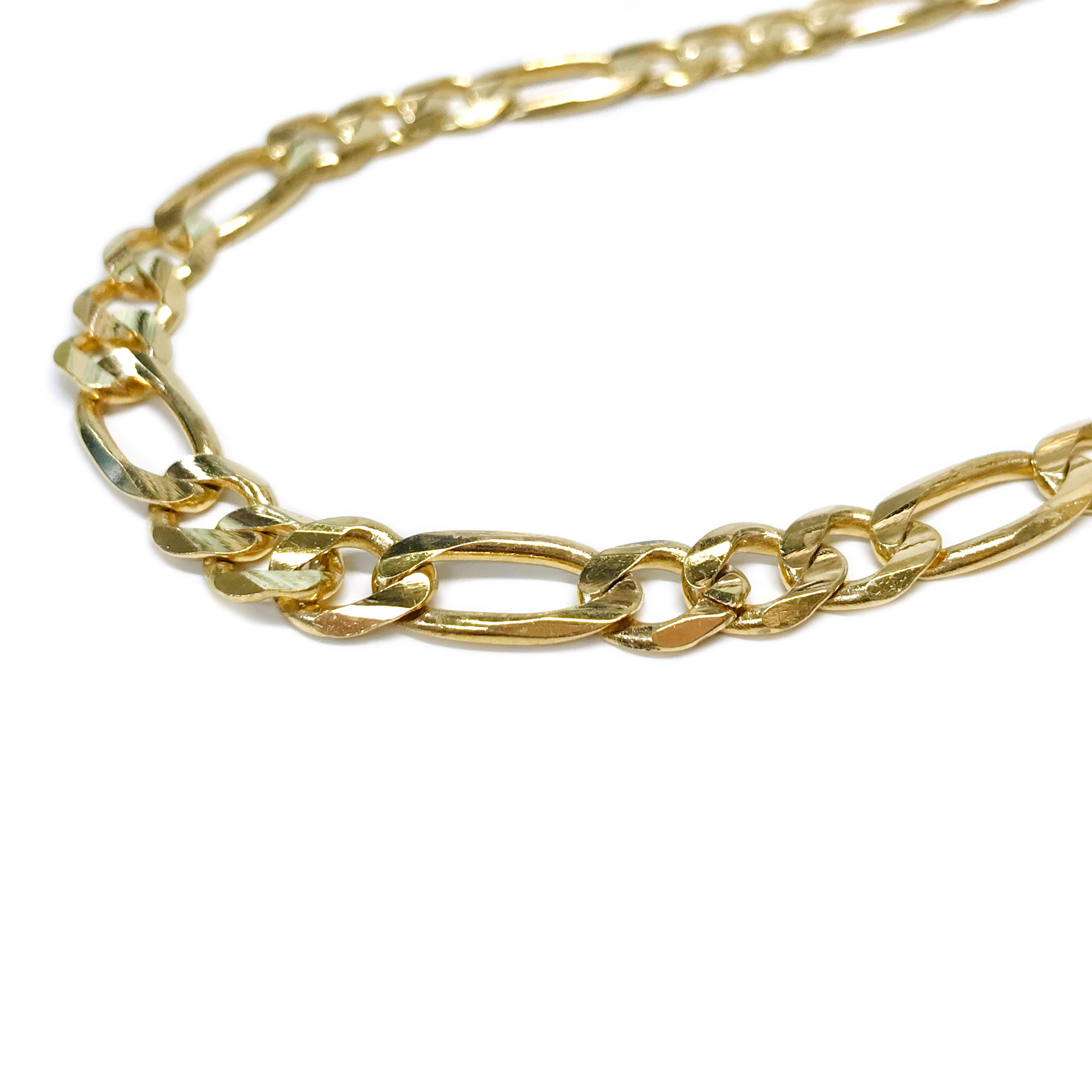 A classic 14 Karat Yellow Gold Figaro Necklace 1mm thick x 6mm wide and 17