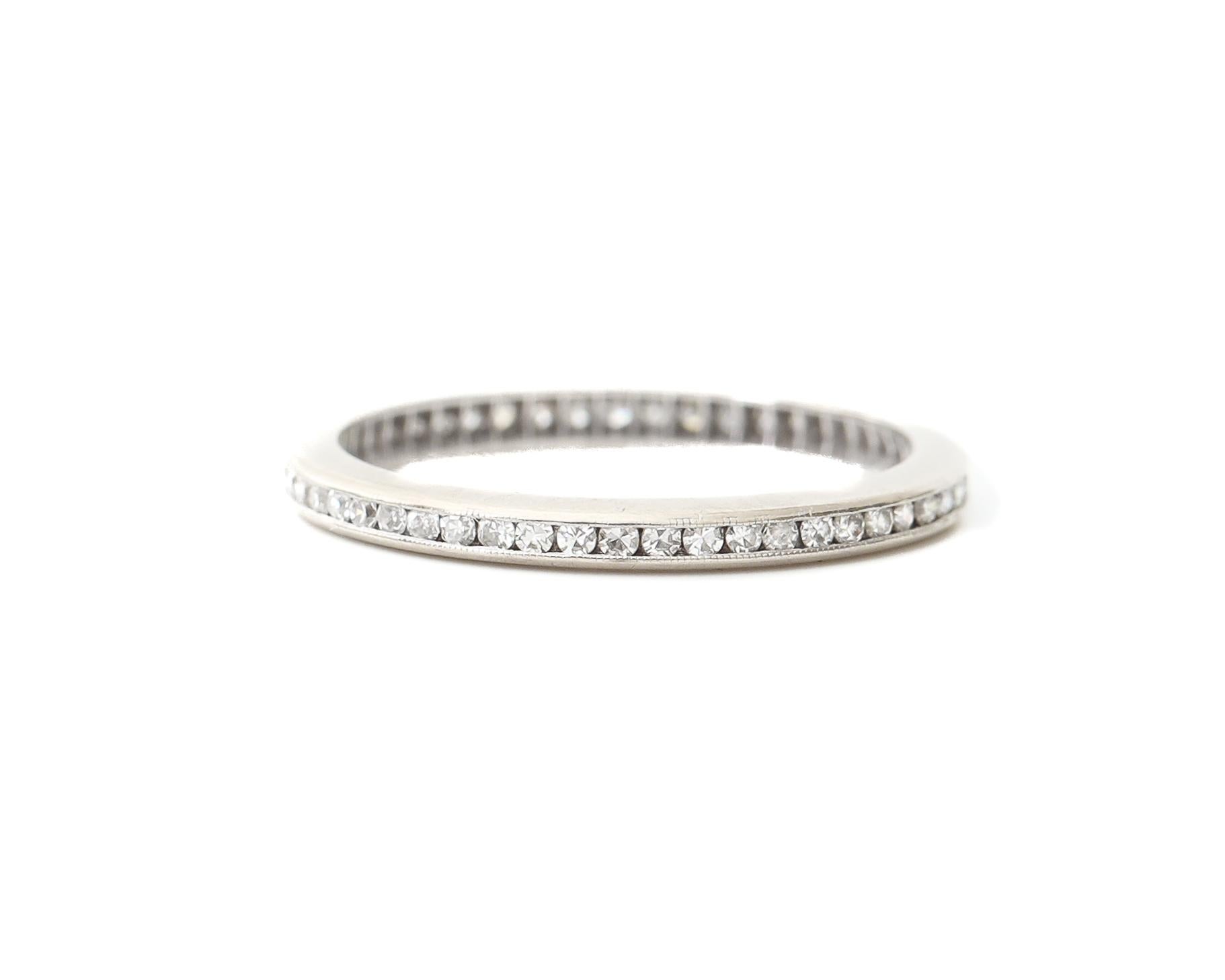 Description: 
Here we have a sparkling 1950s  diamond eternity wedding band! The diamonds are 0.70 cttw of antique single cuts. There is a pierced open back pattern throughout the ring to allow light and brilliance to be at a maximum for each stone