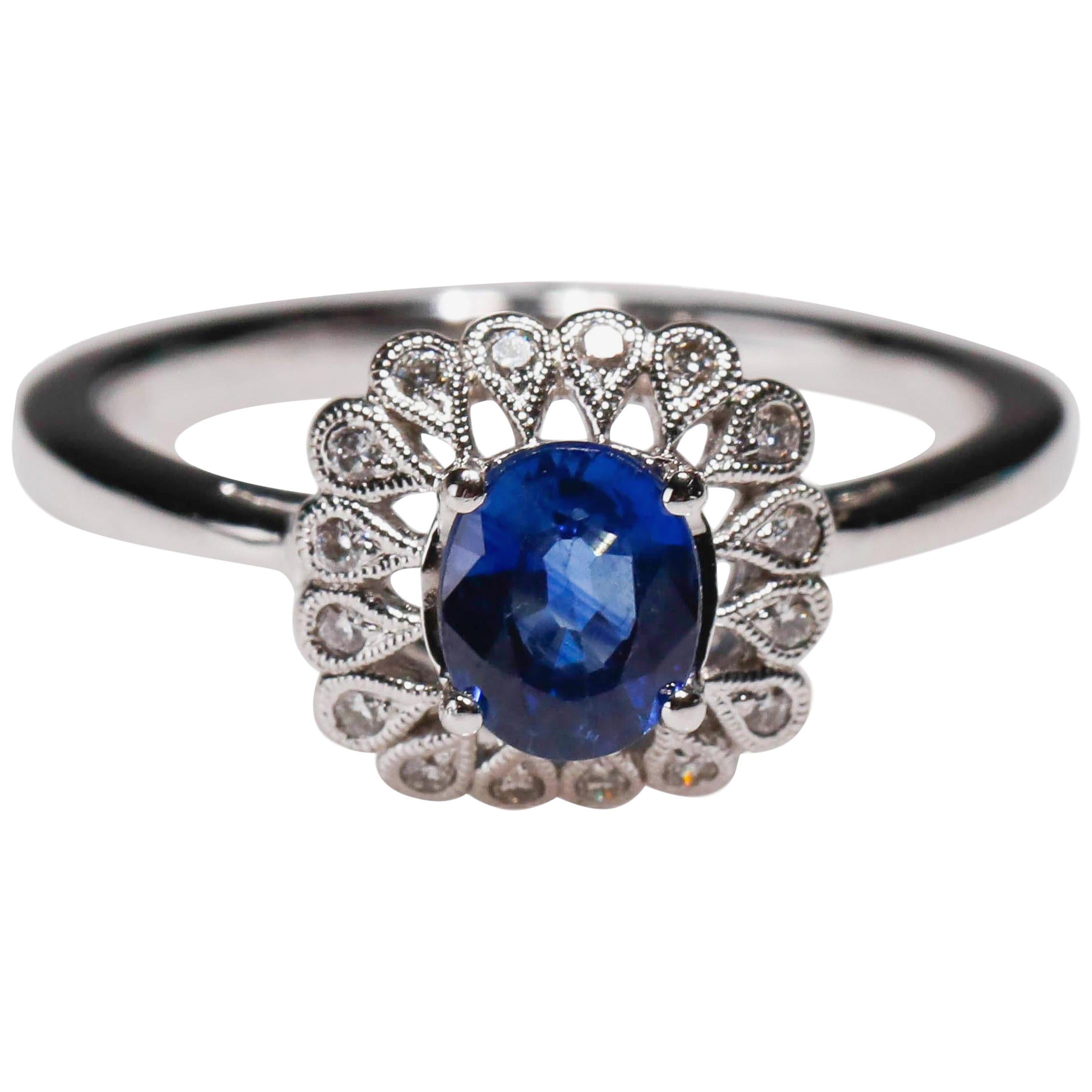 14 Karat White Gold 0.87 Carat Oval Blue Sapphire Diamond Floral Halo Ring