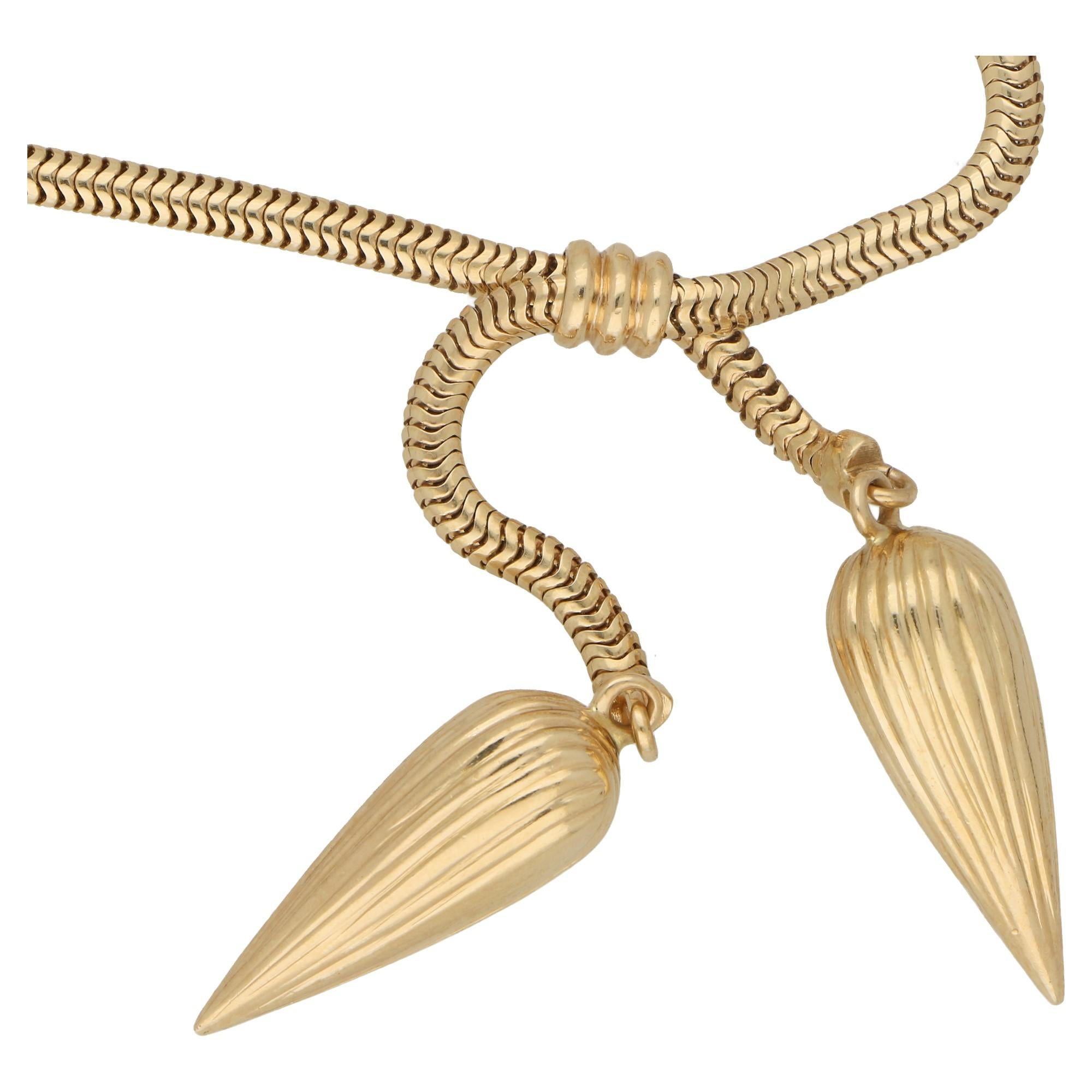 Extremely elegant and tactile 1940's necklace made in 14 carat yellow gold. Tubular link with detailed upside down pear shaped drops. The necklace can be shortened or lengthened by sliding one end up the necklace. The necklace is secured by a