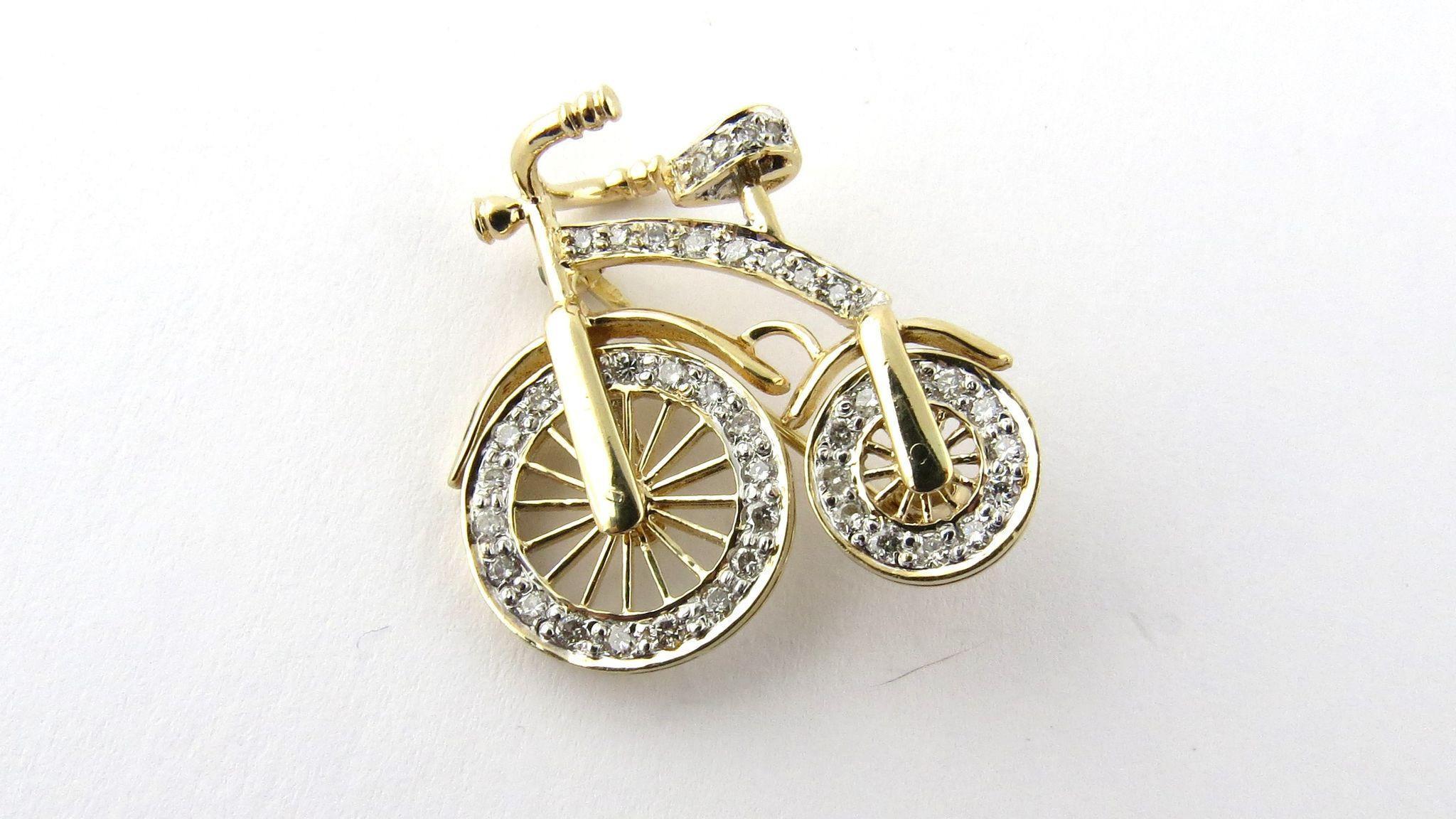 Vintage 14K Yellow Gold 3D Big Wheel Bicycle with Diamond Spinning Wheels 

23 mm x 25 mm 42 diamonds - approx 1 ct total diamond weight VS clarity diamonds -white with lots of sparkle 3.45 dwt 5.4 g 

Both wheels spin Beautiful well made piece