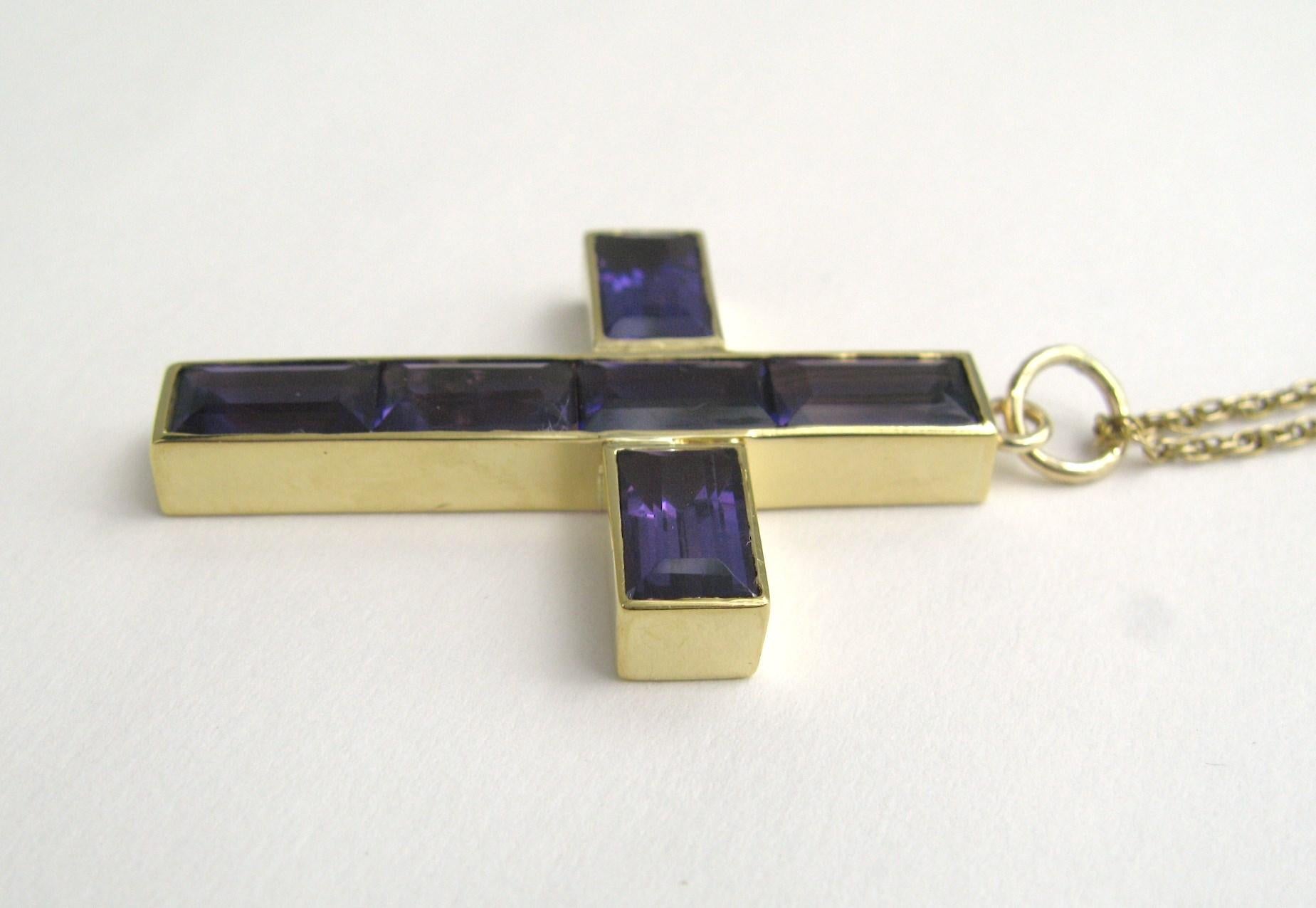 Stunning 14K gold Cross with 6 channel set amethyst stones, Approximately 8.5 Carats. Cross measures 1.6