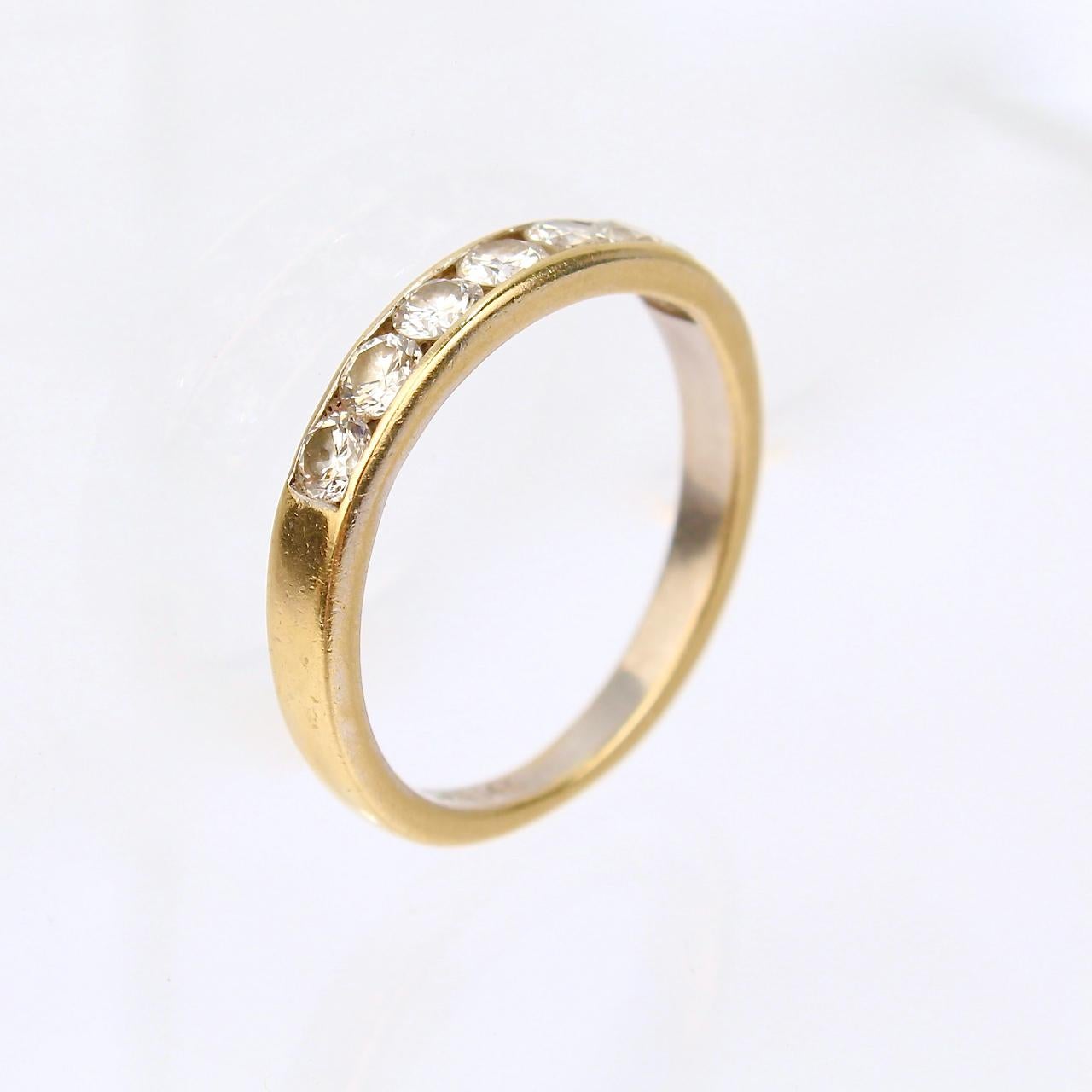A very fine gold and diamond band ring.

In 14k yellow gold.

With 7 channel-set, round-cut white diamonds with lovely color and lots of fire.

Simply a beautiful natural diamond ring!

Date:
20th Century

Overall Condition:
It is in overall good,