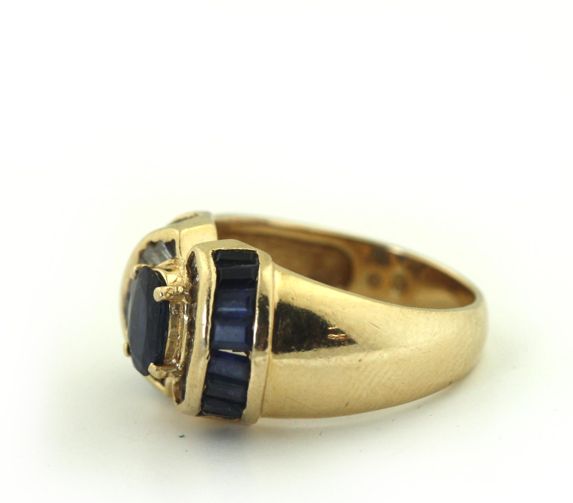 
14 Karat Gold and Colored Stone Ring
Centering an oval-shaped sapphire, flanked by baguette cut diamonds, size 6, with partial maker's marks, gross weight 6 grams
