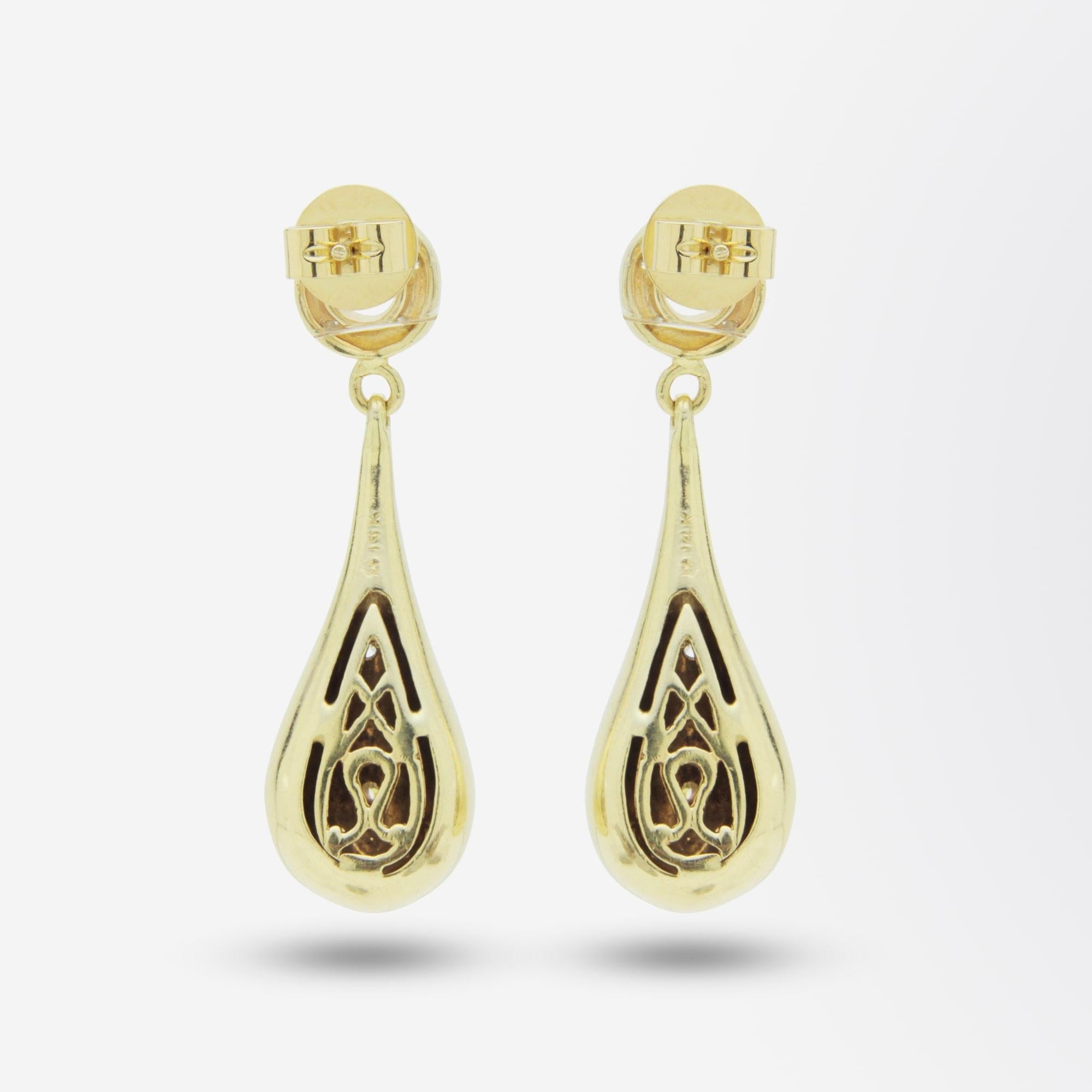 A fine quality pair of gold ear studs which have a hanging gold 'teardrop' that have been pressure set with brilliant cut diamonds. The 14 karat gold body of the earrings have been set with a combined 0.70 carat of brilliant cut, G/H colour and