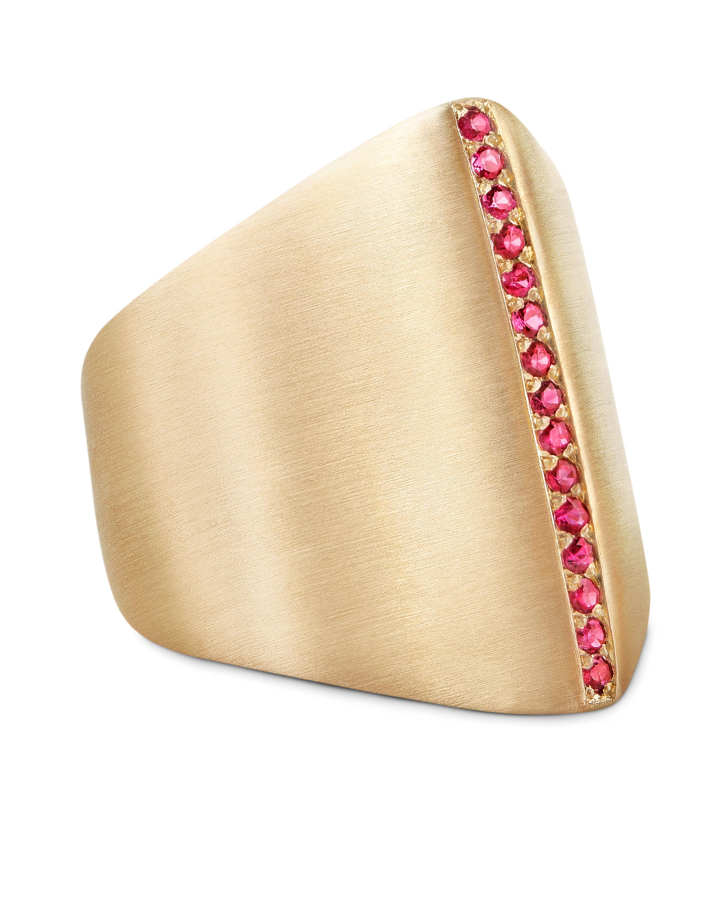 This sculptural ring is cast in solid 14-karat yellow gold and polished to a satin finish.  The ring features a row of fifteen pave-set Sri Lankan rubies for a total of 0.18 carat weight. 
Part of a capsule collection of updated statement rings, the