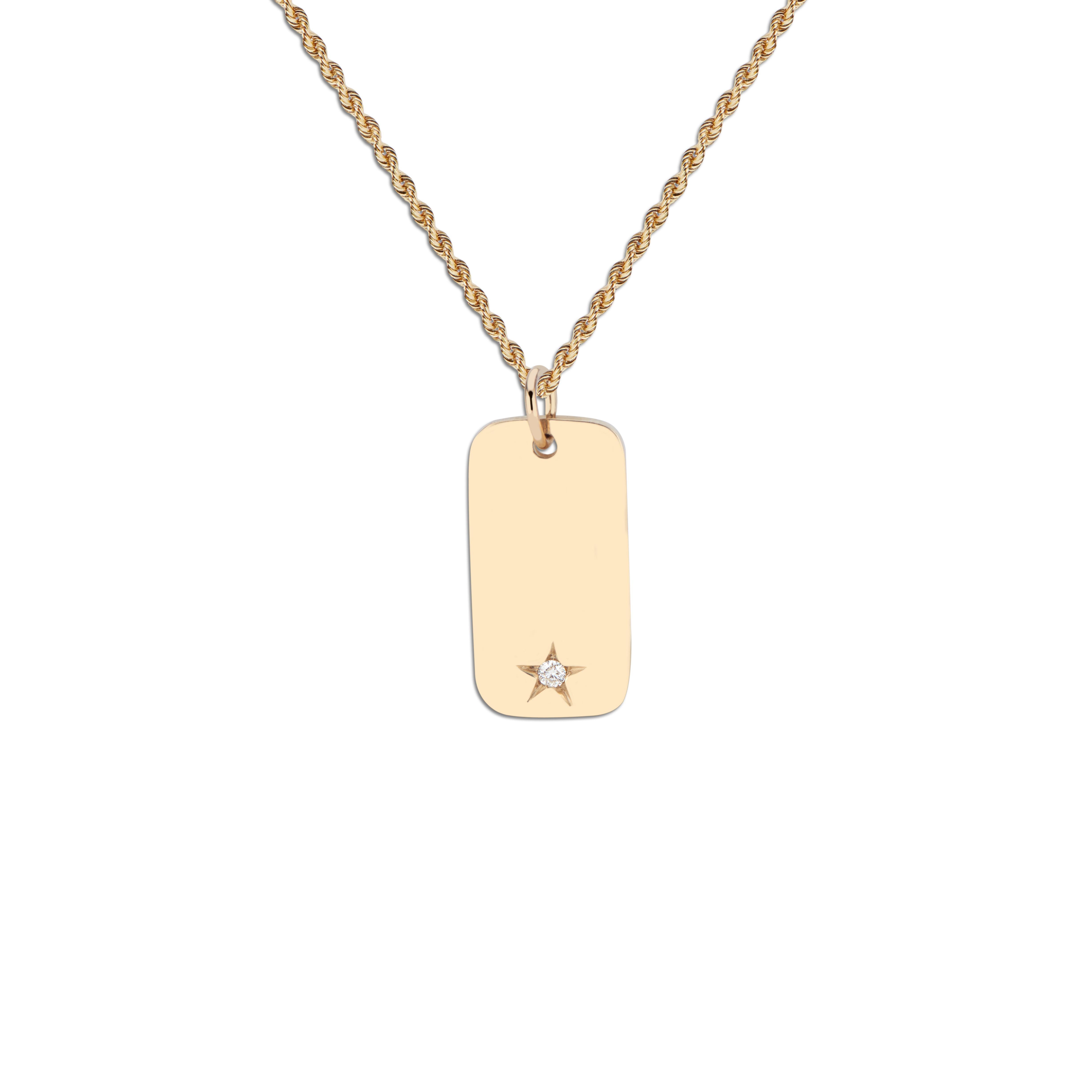 This 14k gold Memento Tag features a star engraving with a diamond setting.  It can be engraved with initials or a special date, or it can be worn plain to show its sleek, polished shine.

This Tag is ready to ship.

