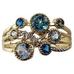 Ring aus 14 Karat Gold mit Apatit, Topas, Zirkon, Aquamarin, Prasiolith und Diamant