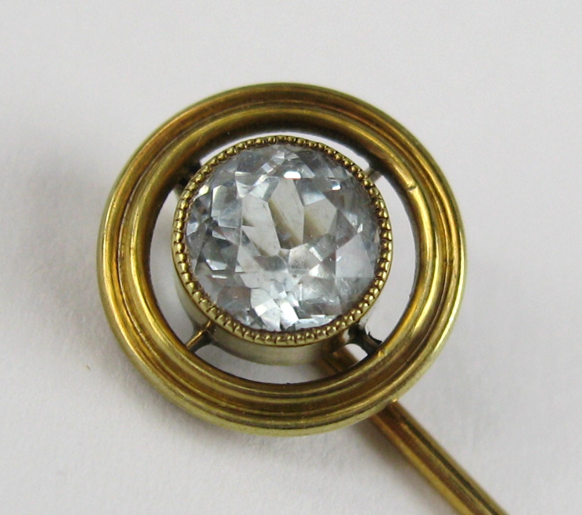 Lovely 14K Gold Aquamarine Stick Pin. Aquamarine measuring 6.6mm inside a gold setting. Outside Gold circle is .44in. Stick measures 2.72 in.  This is out of a massive collection of Contemporary designer & Vintage clothing as well as Hopi, Zuni,