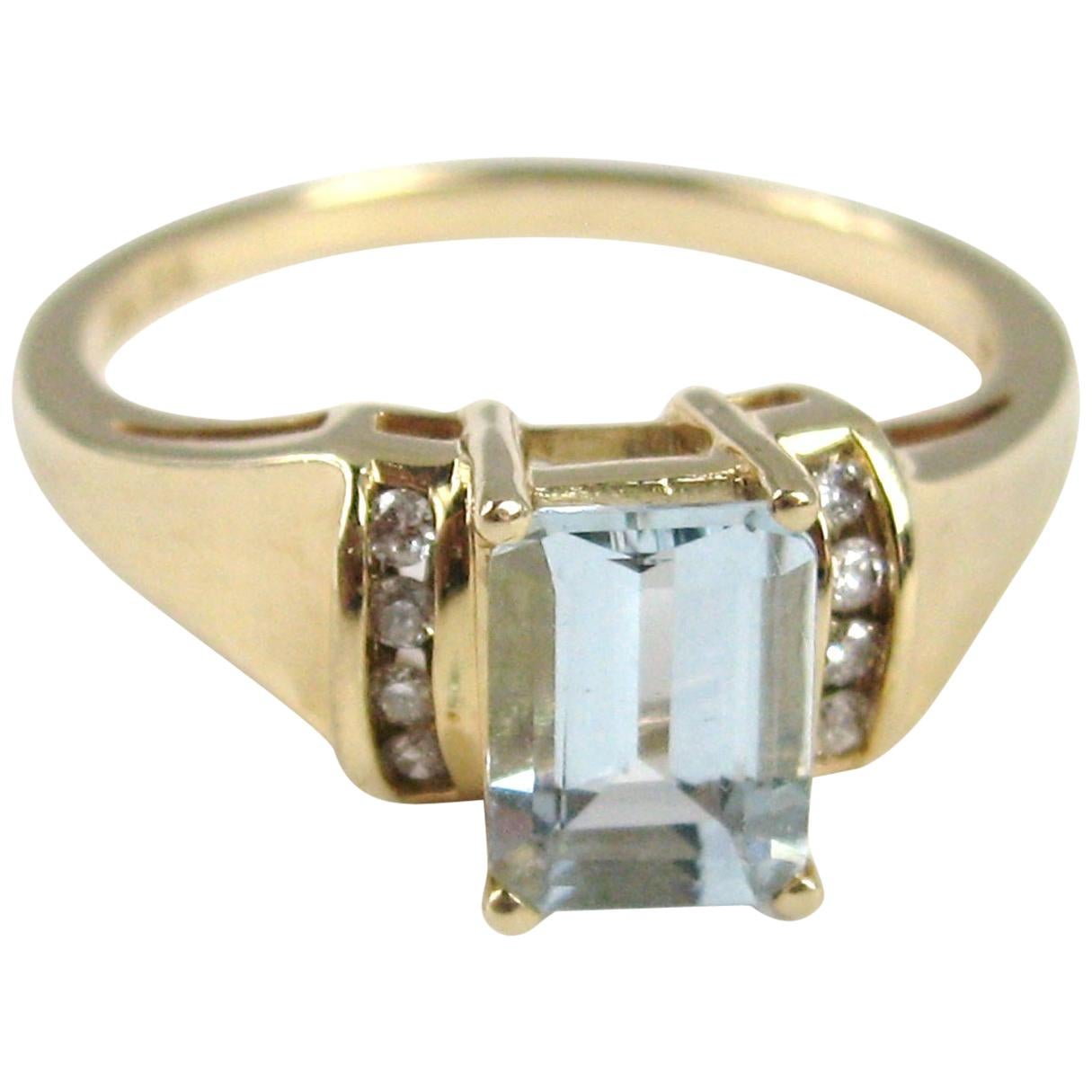 14 Karat Gold Aquamarine and Diamond Emerald Cut Ring