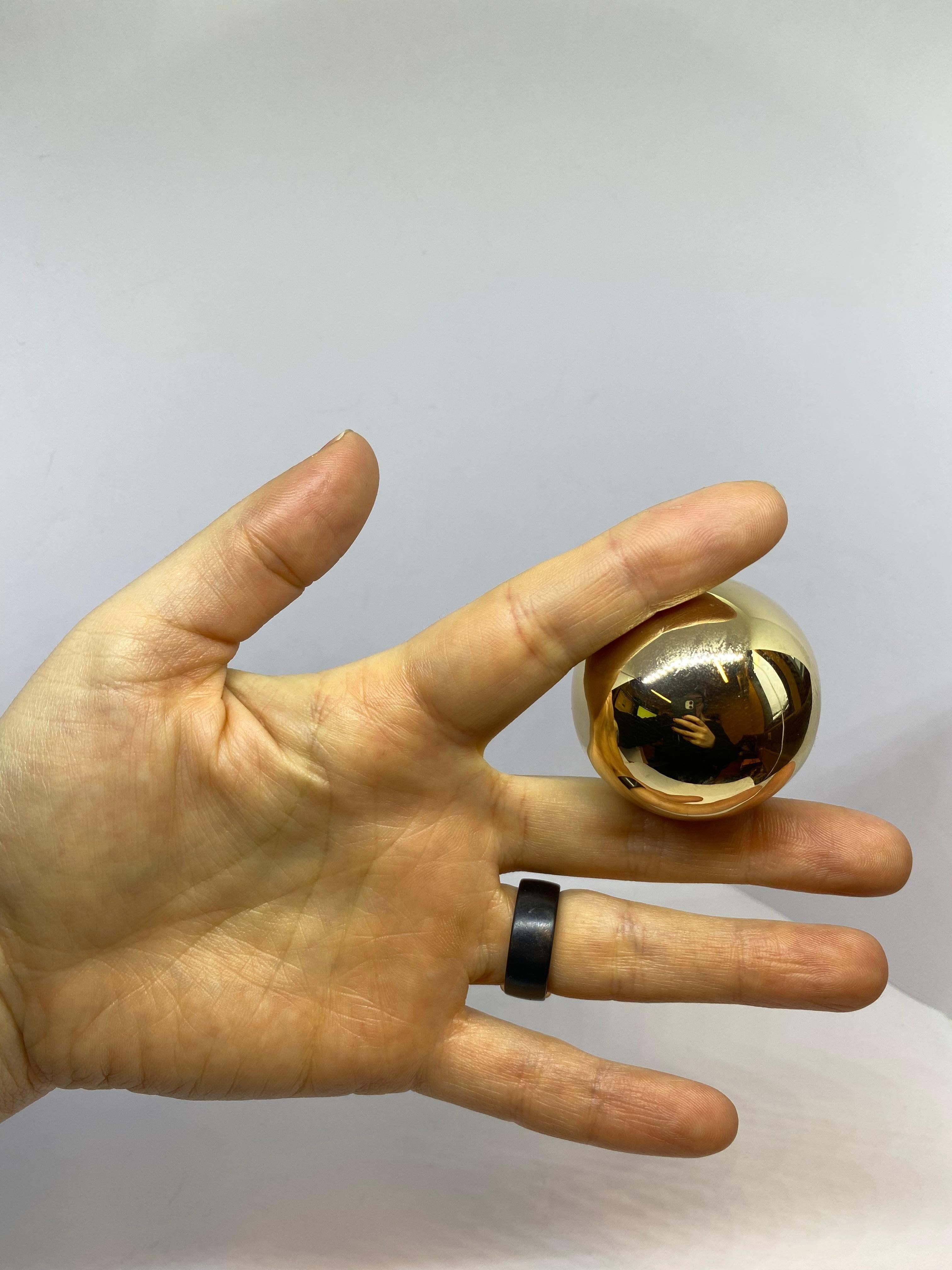 14 Karat Gold Ball, Magic Ball Caviar decorations...

The ball is 14 Karat Gold
585 Proof.
Made in Finland in 1968
Author (RKS) Railo K. Säde Helsinki Finland.
The ball is hollow but still weighs 30G
Included in the picture where the ball was Caviar
