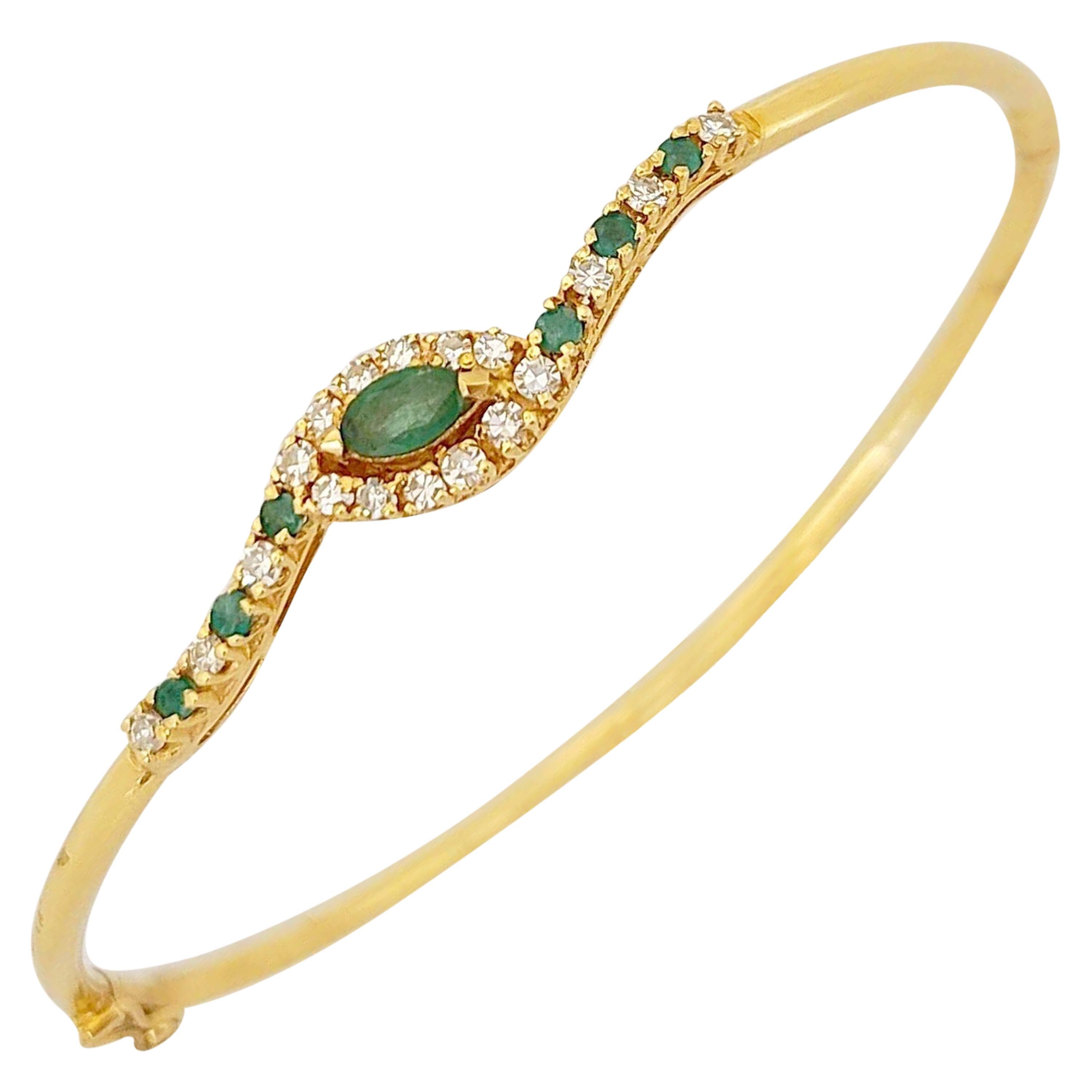 14 Karat Gold Bangle Bracelet with.85 Carat Emeralds and .33 Carat Diamonds For Sale