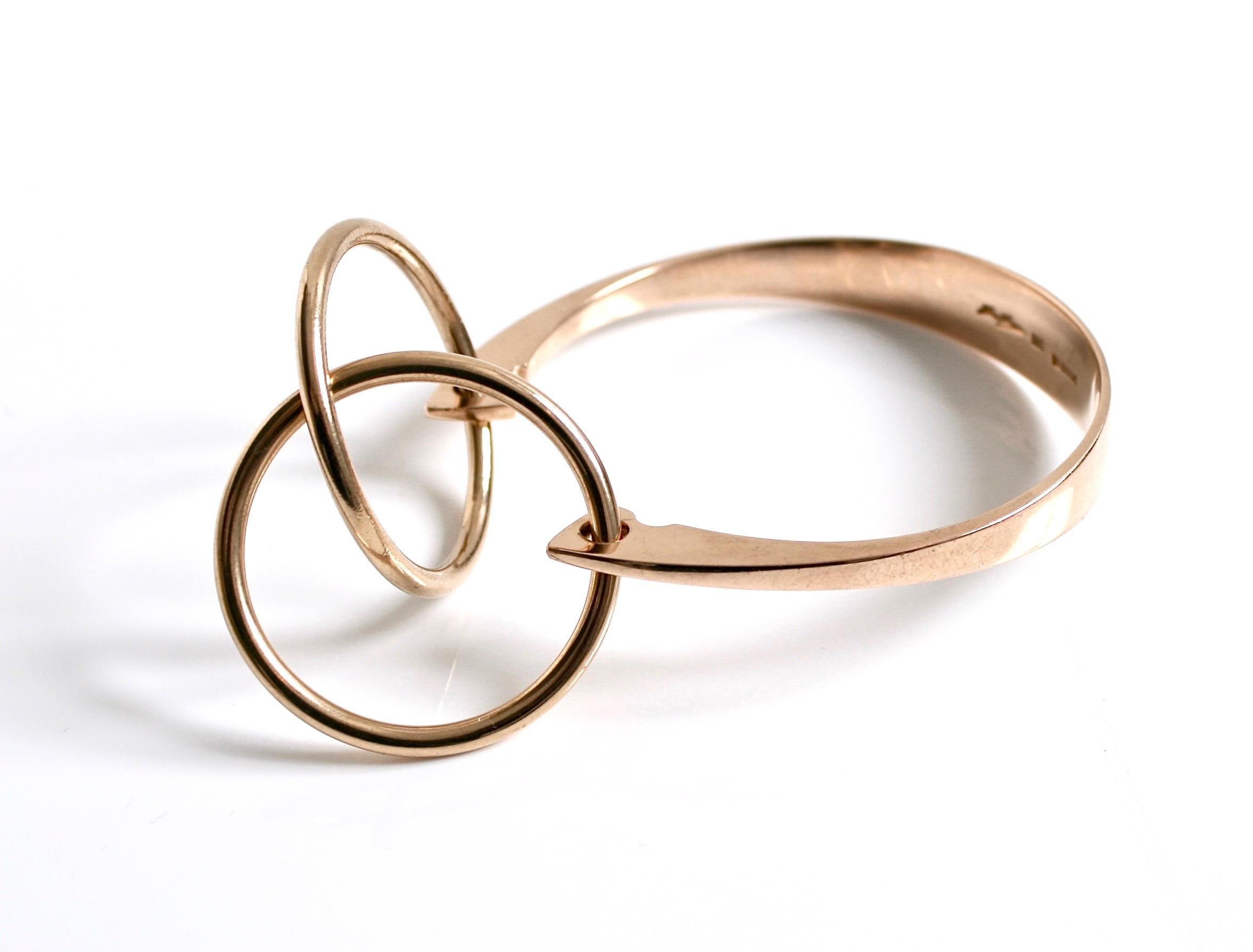 Rare 14k rose gold bangle designed by Bent Gabrielsen c.1970 for Hans Hansen Denmark 
Double ring on the front of the bangle

Bent Gabrielsen Pedersen (born in 1928) studied at the Danish College of Jewellery
and Silversmithing which produced all