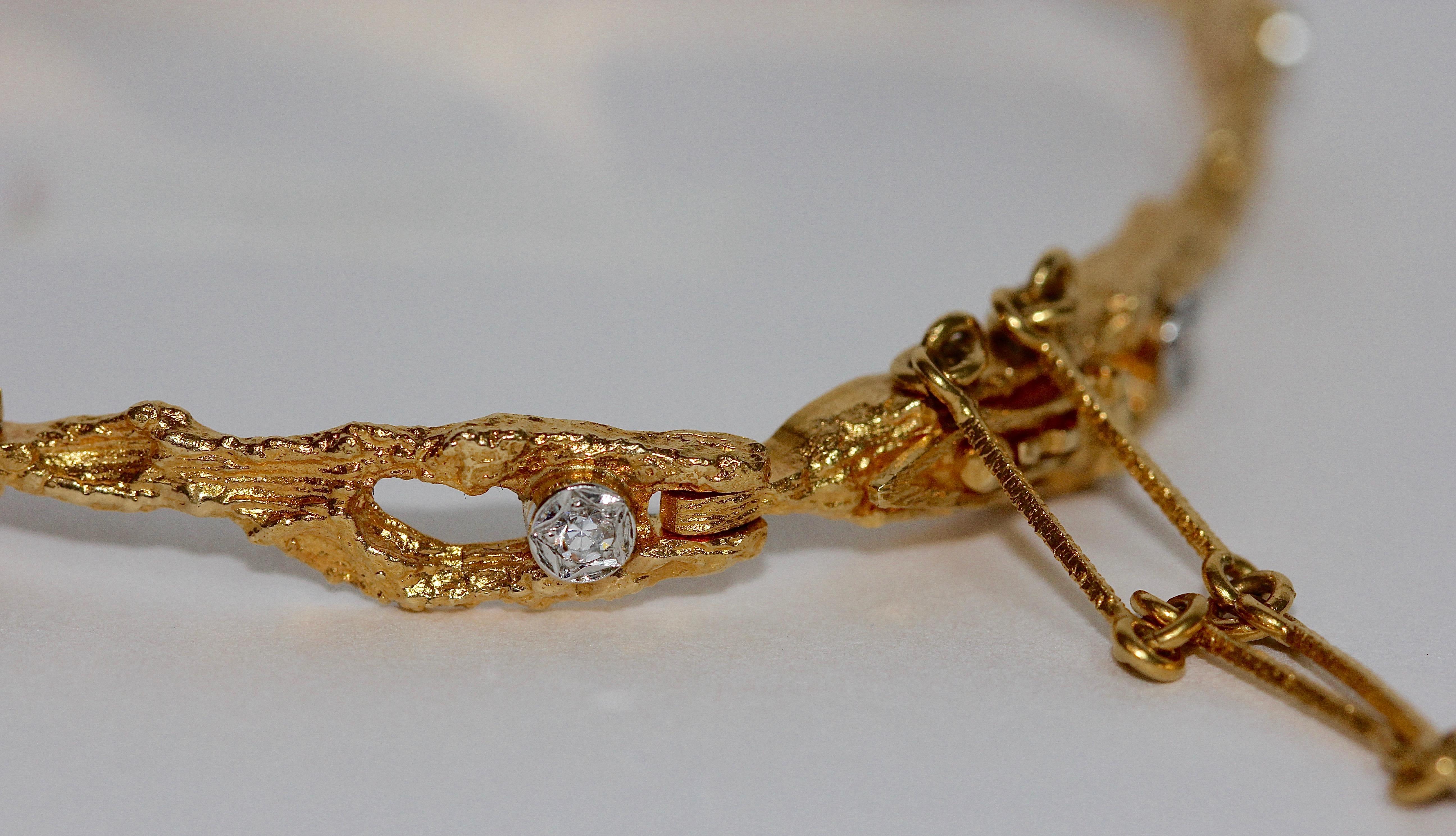 Beautiful bracelet from the designer brand Lapponia.
14k gold, set with eight small diamonds.
Inner diameter circa 590mm.

Björn Weckström.
