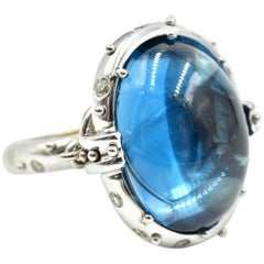 14 Karat Gold Cabochon Blue Topaz with Cognac and White Diamond Accents Ring