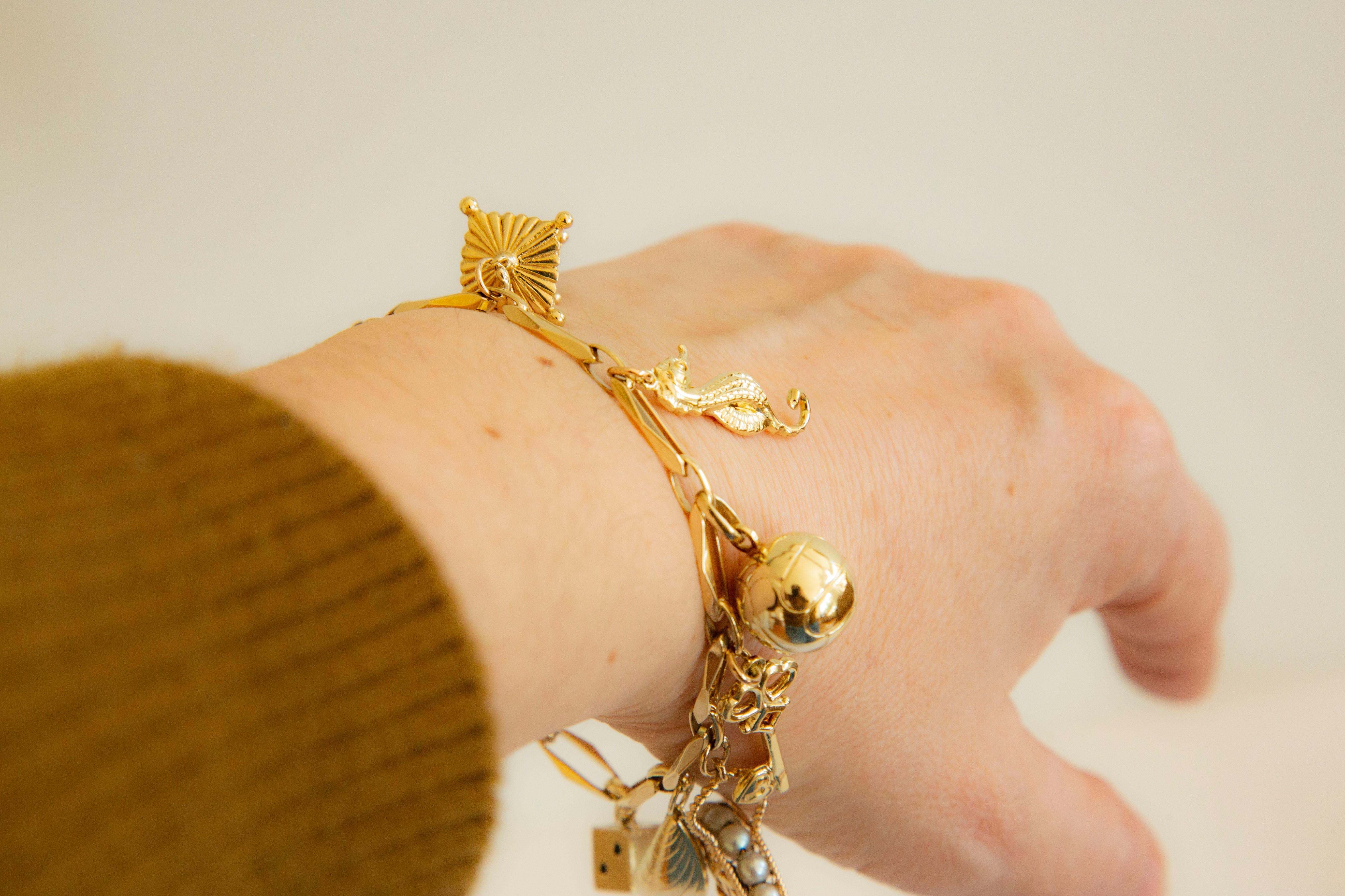 Women's or Men's 14 Karat Gold Charm Bracelet Middle of the 20th Century For Sale