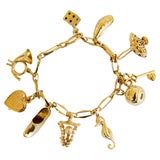 Midcentury Italian Gold Etruscan Revival Charm Bracelet-11 Assorted Color  Charms — Benchmark of Palm Beach
