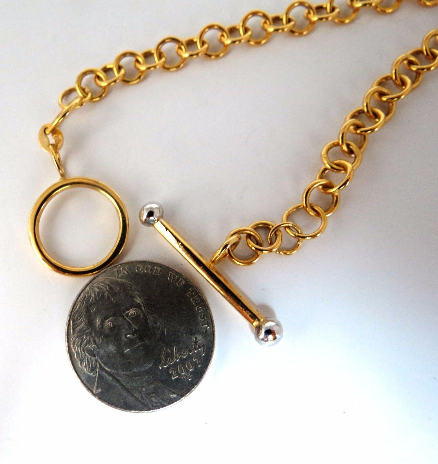 Toggle Circles Link

Necklace:

15 Inches (wearable length)

15mm Large circles (center)

5.7 mm smaller circles

Toggle Bar: 1.05 inch

Toggle circle: .60 inch



14kt. yellow gold 

15 Grams.

Comfortable Toggle Slip