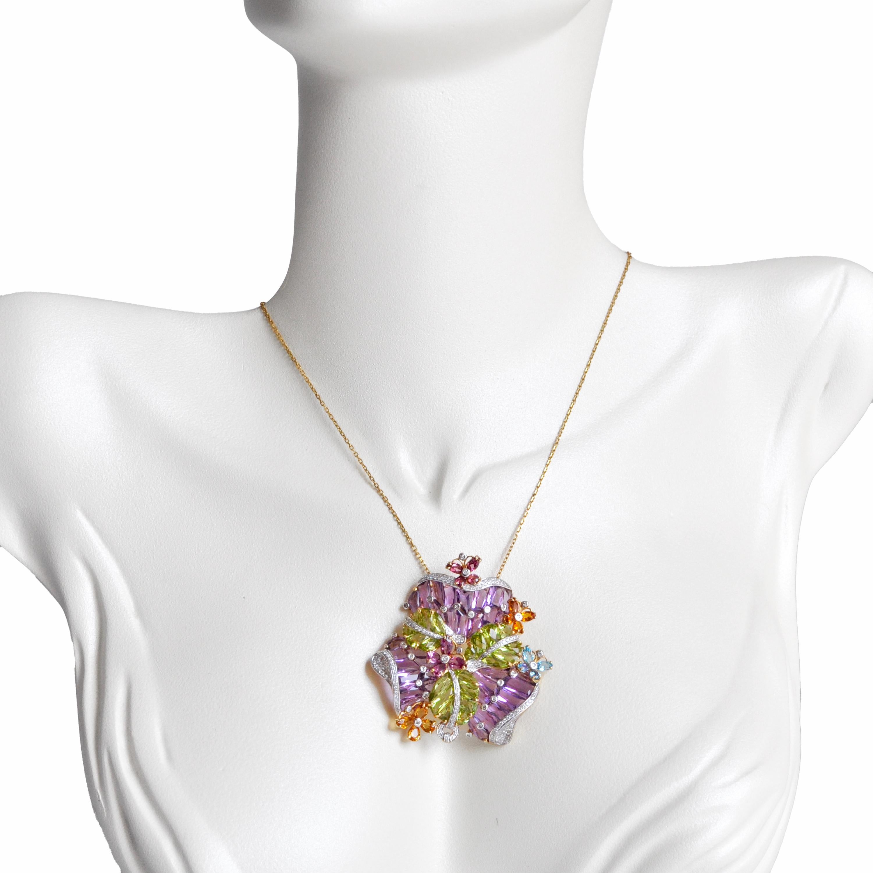14 karat gold cocktail amethyst peridot citrine topaz tourmaline pendant brooch

Discover the Amethyst and Peridot Pendant Necklace, a masterpiece of color and design. This versatile piece seamlessly combines the regal allure of tapered baguette-cut