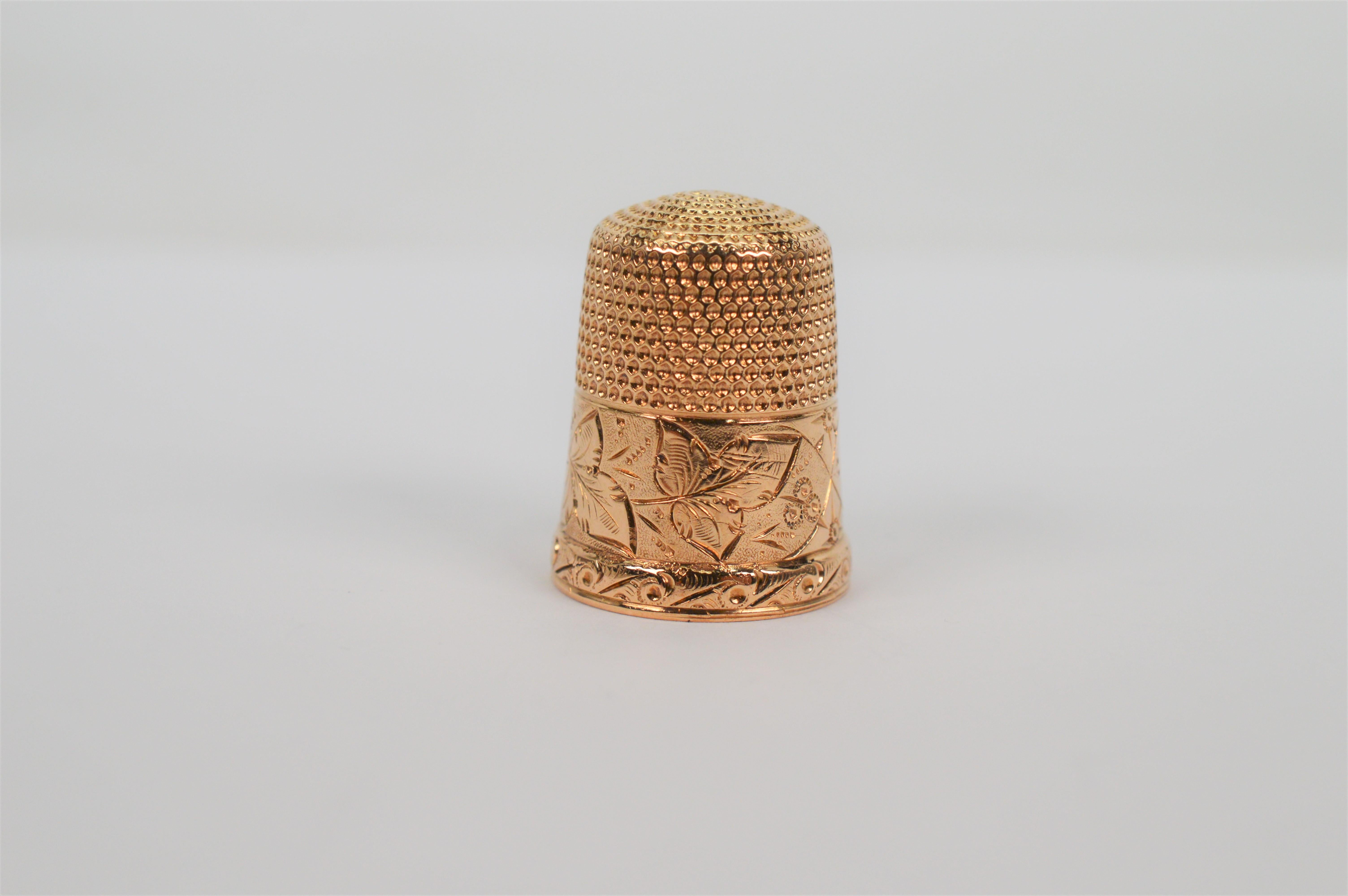 Add this adorable piece to your collection. Hand engraved fourteen karat 14 Karat yellow gold sewing thimble. 7/8 inch tall. 3.2 penny weight. Stamped 14k by maker. Gift boxed.