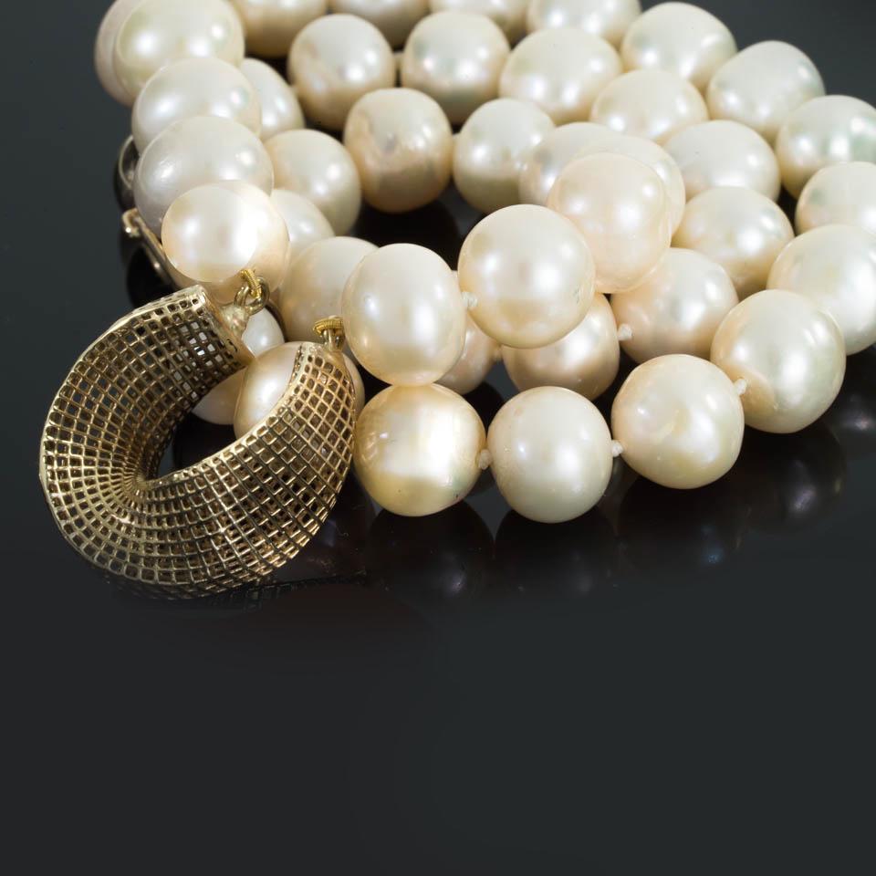 Contemporary 14 Karat Gold Cream Freshwater Pearls, Net Mobius Center Piece For Sale