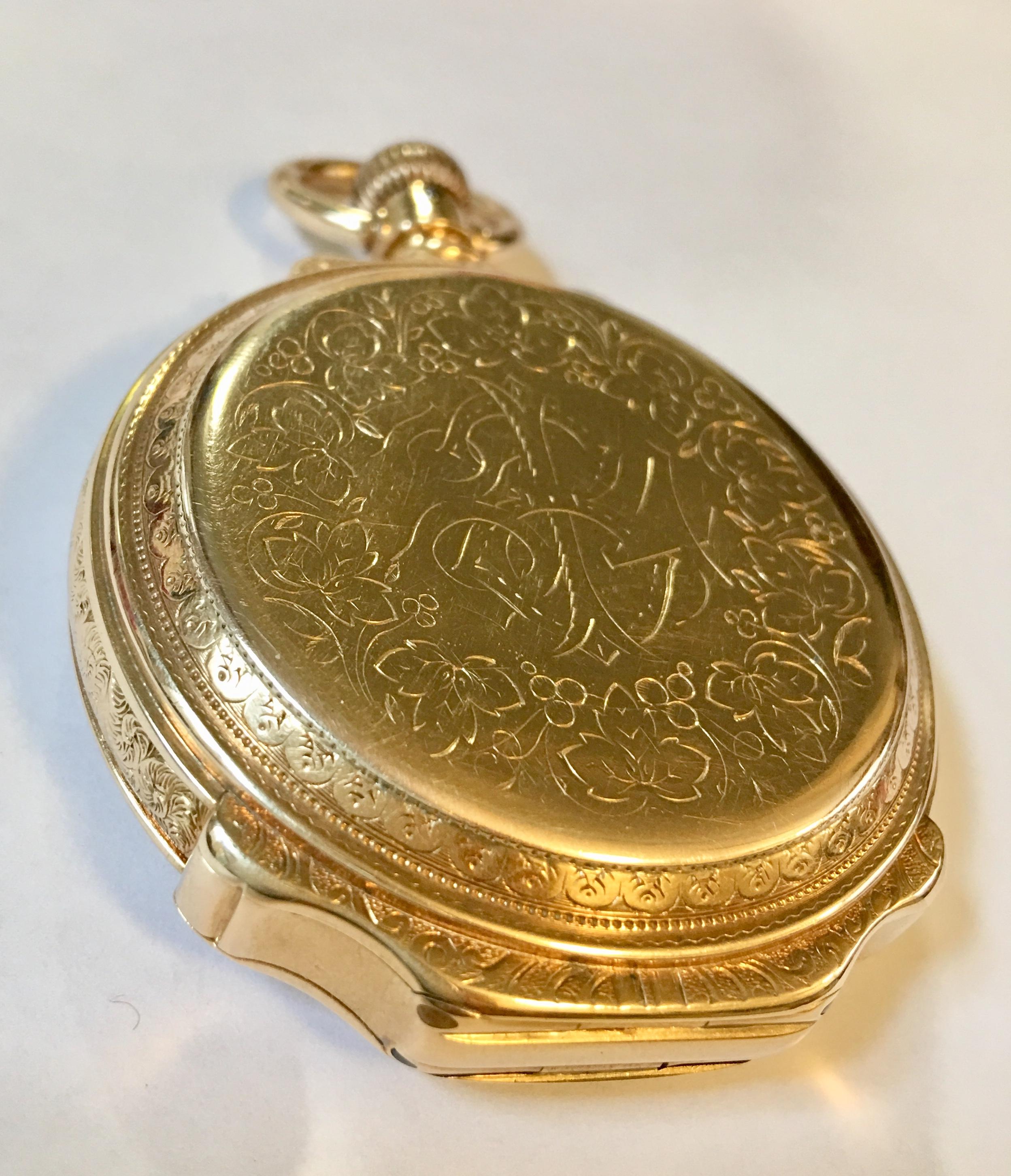 A 14-karat gold solid full hunter pocket watch. The watch has a white enamel dial signed D.Gruen & Son with Arabic numerals and a subsidiary second hand dial. Also, has a smooth stem wind, a hinged back cover to protect its works and front cover