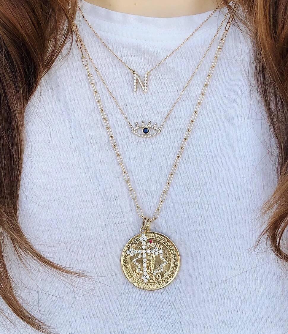 The 14k gold, white diamond, and ruby Immaculate Mary Medallion is cast from an antique medal.    

It is available in all metals.

This piece is made-to-order, so please leave 3-4 weeks for delivery.  Contact for rush options.