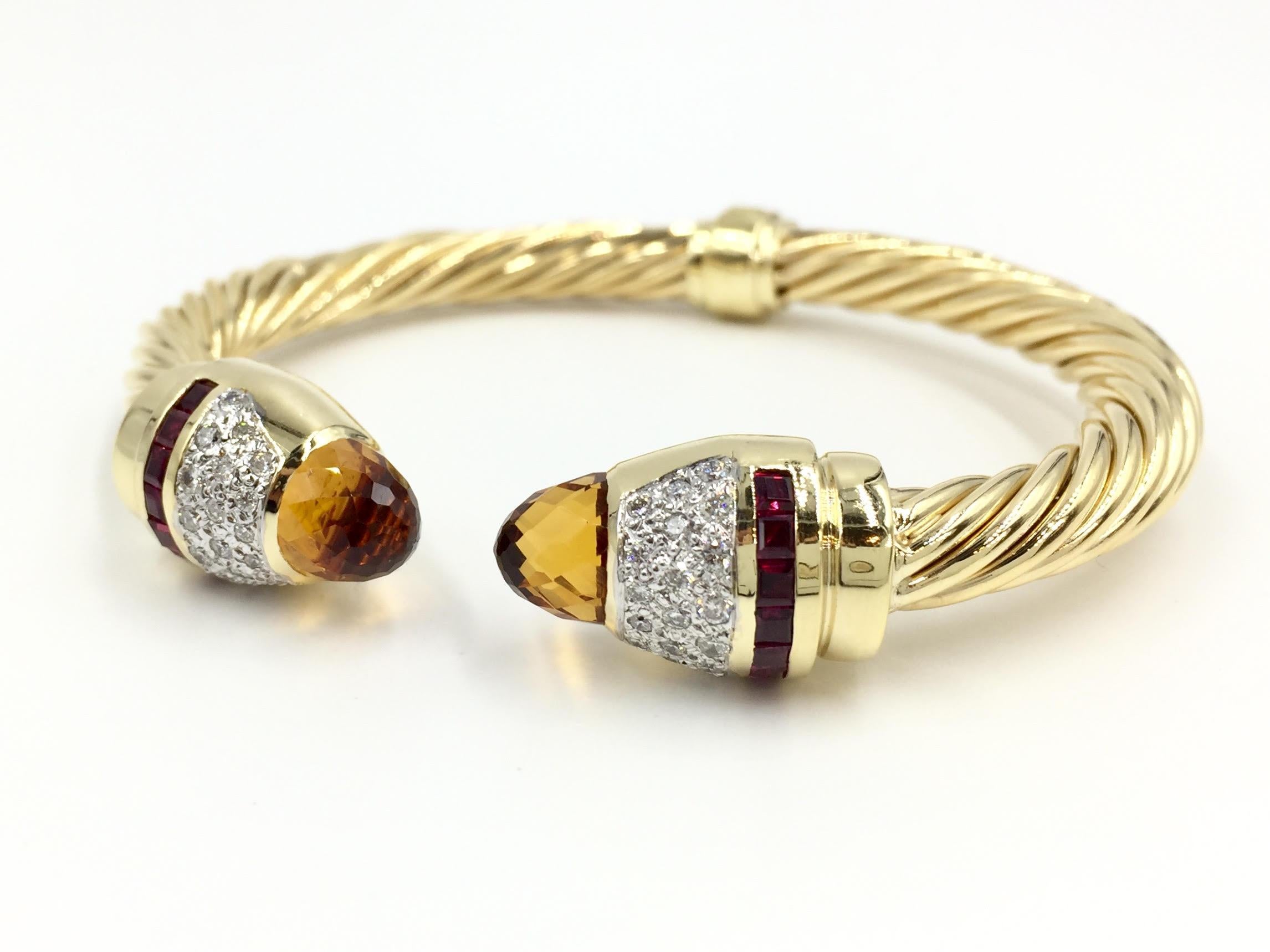 Polished 14 karat yellow gold cable style cuff bracelet featuring two beautifully faceted Citrines at each end, 0.80 carats of pavé set diamonds and channel set princess cut Rubellites. Diamonds are approximately G-H color, SI1 clarity
Bracelet has