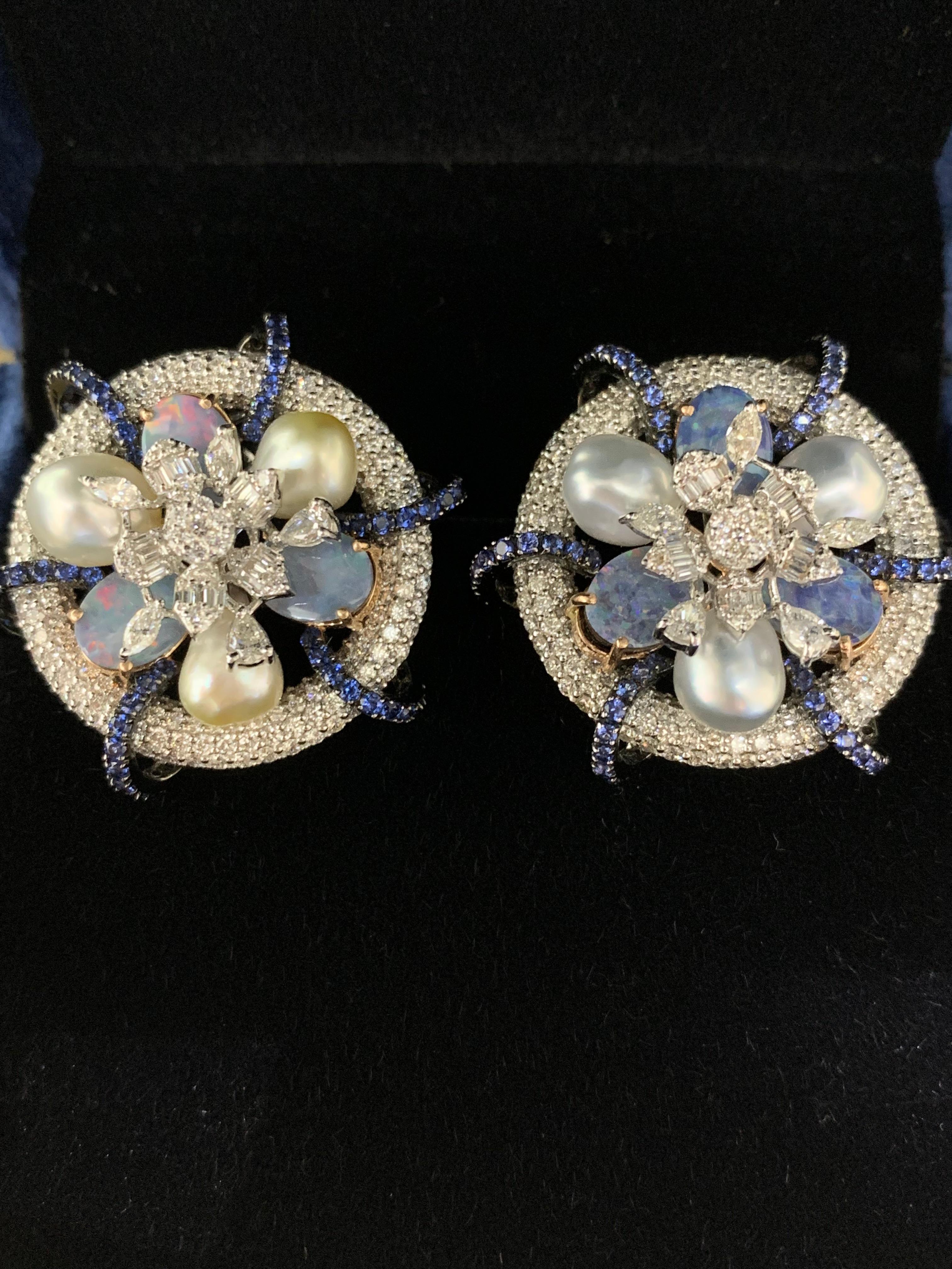Statement earrings are great for making a powerful impression.

Diamond Weight: 4.94 carats
Gold Weight: 19.010 gms
Pearl Weight: 10.41 carats
Color Stone: 5.67 carats