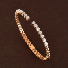 Bracciale aperto con diamanti in oro 14 carati