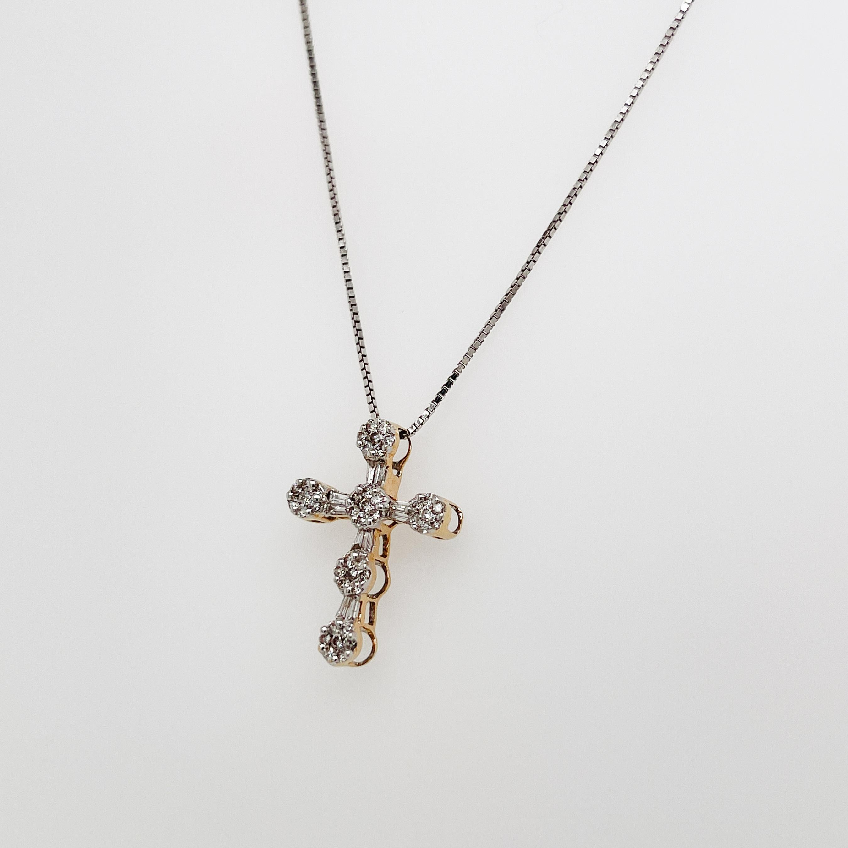 A very fine vintage estate cross pendant.

In 14k gold.

Prong-set with 42 tiny round diamonds & 10 tapered baguette cut diamonds.

Together with a 14 karat gold Italian boxchain necklace. 

Simply a wonderful crucifix!

Date:
20th Century

Overall